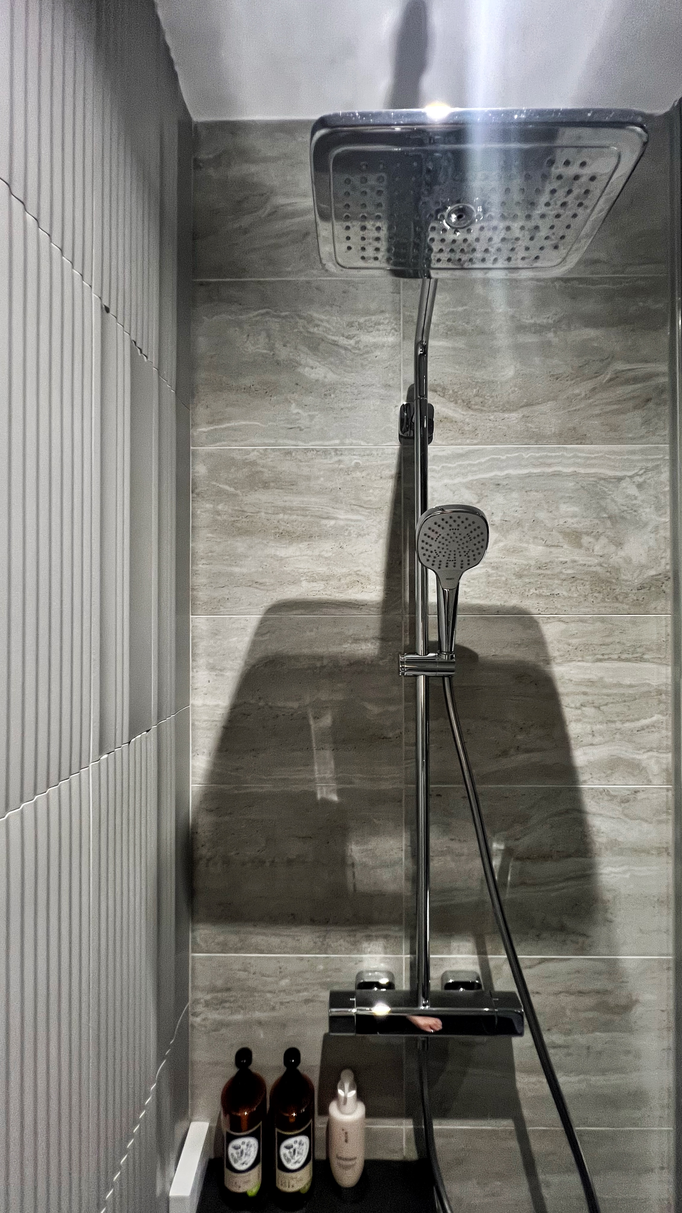 From Routine to Retreat: Crafting a Luxurious Bathroom Experience - Shower enclosure with modern design, sleek metal