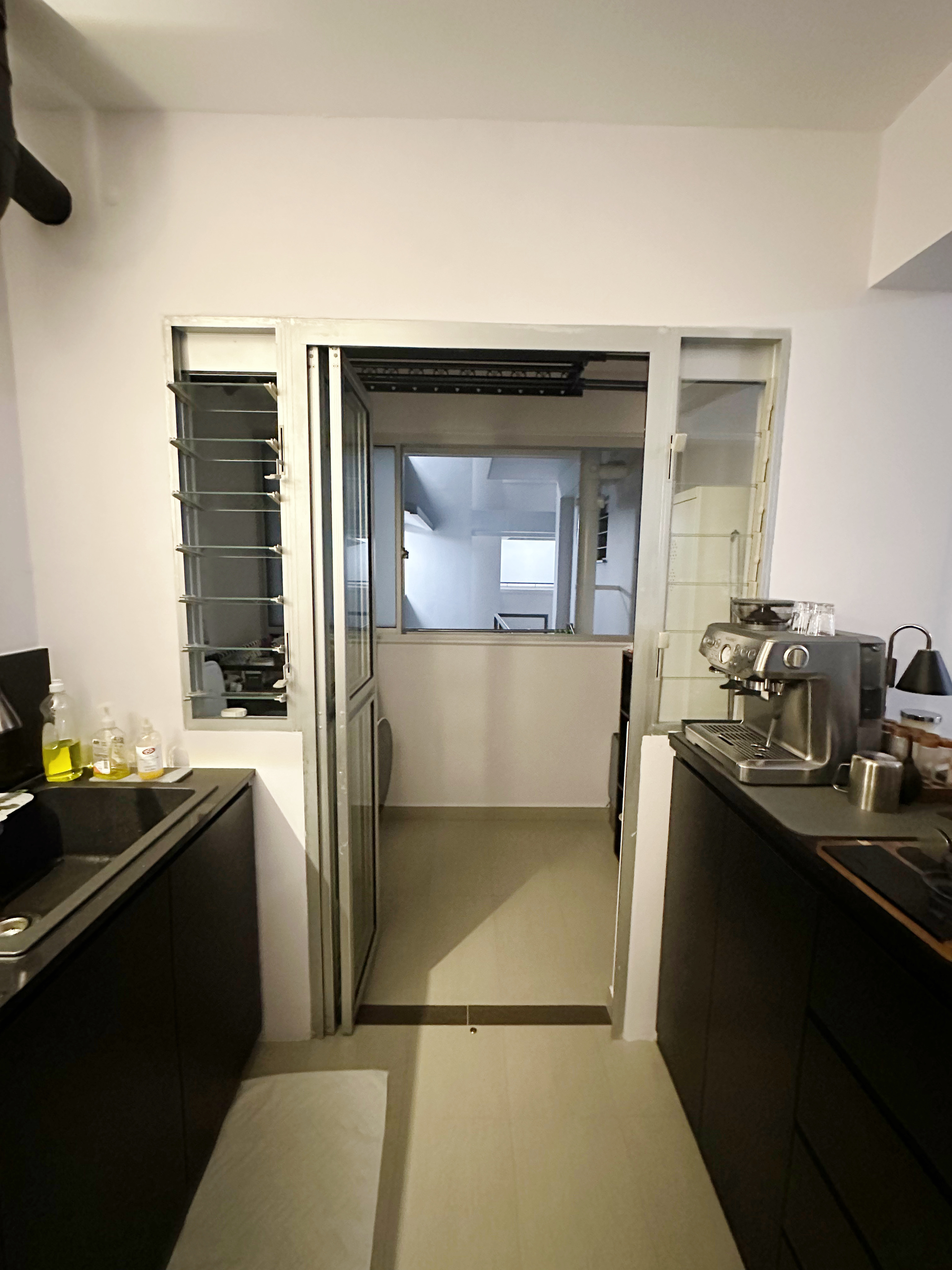 2 Washers in the Service Yard! - Kitchen cabinetry, black countertops, stainless steel appliances, coffee maker, glassware