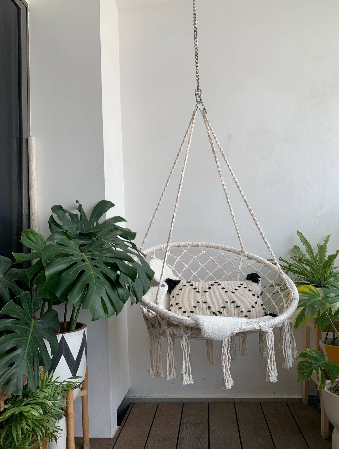 Our 10sqm Balcony: Outdoor Oasis That Makes Our DBSS Look Like A Condo - Wicker hammock with white rope accents, hanging from