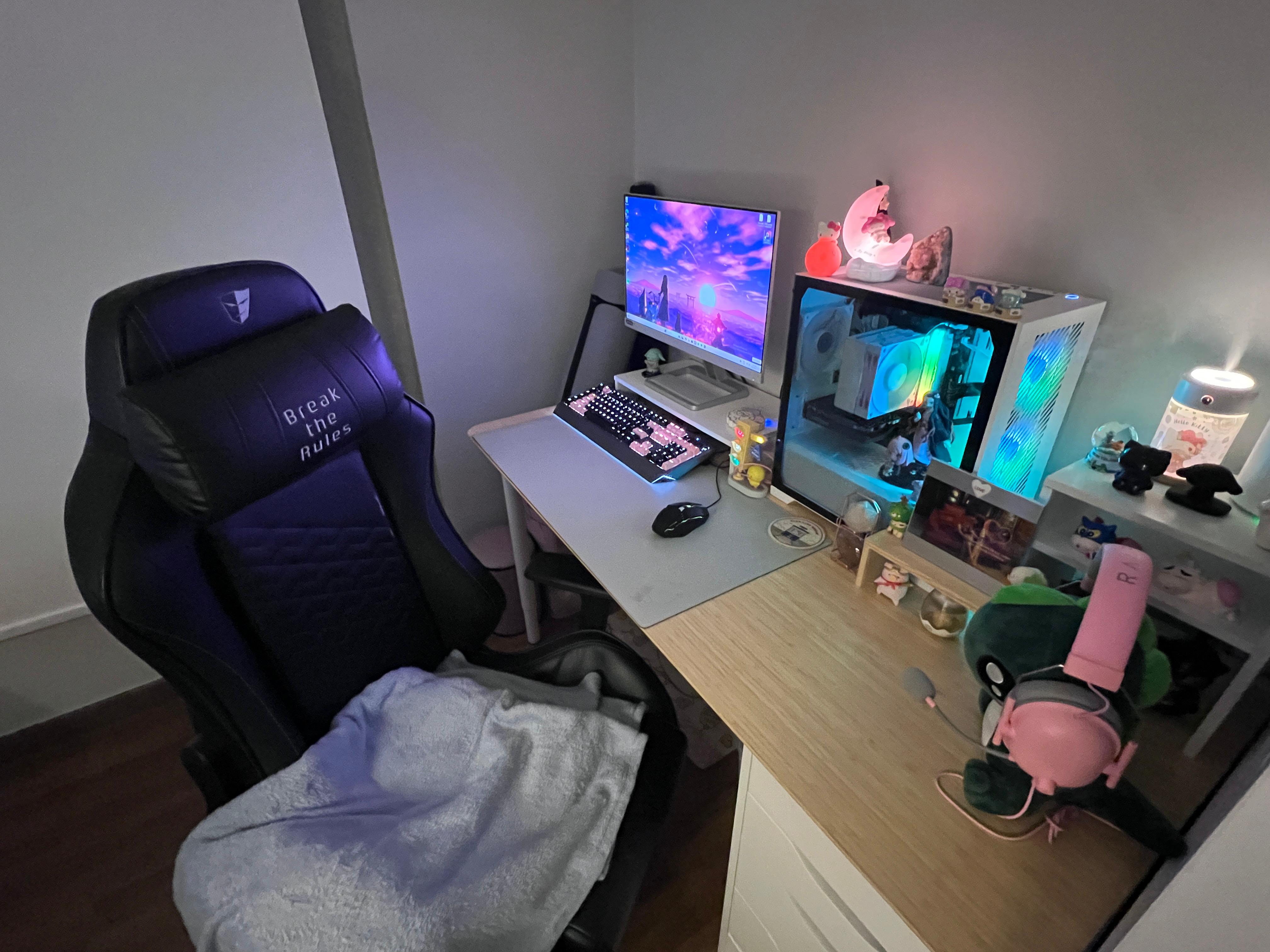 Self Design Work & Gaming Space - Black gaming chair, "Break the Rules" text, dual monitors, RGB lighting, keyboard with pink