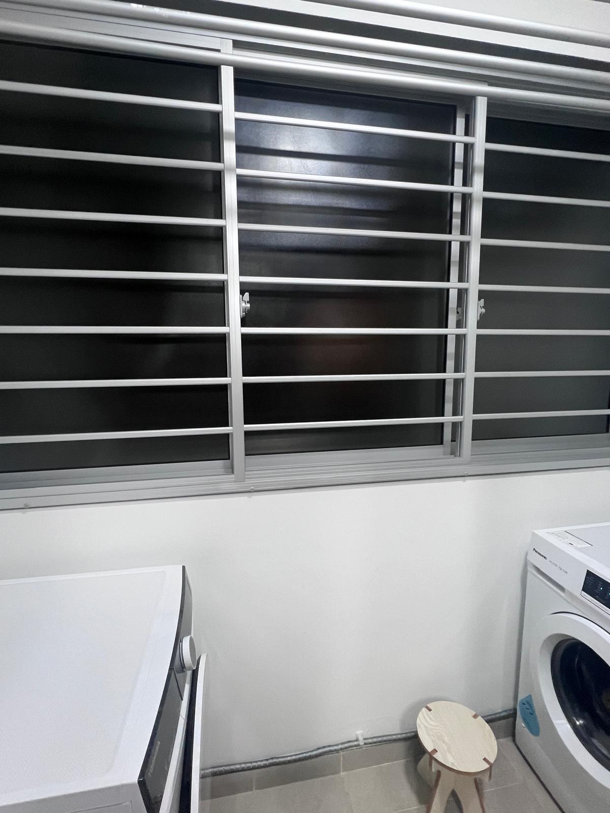 Service yard with zero built in! - Modern laundry room, window with metal bars, white washing machine, small wooden stool