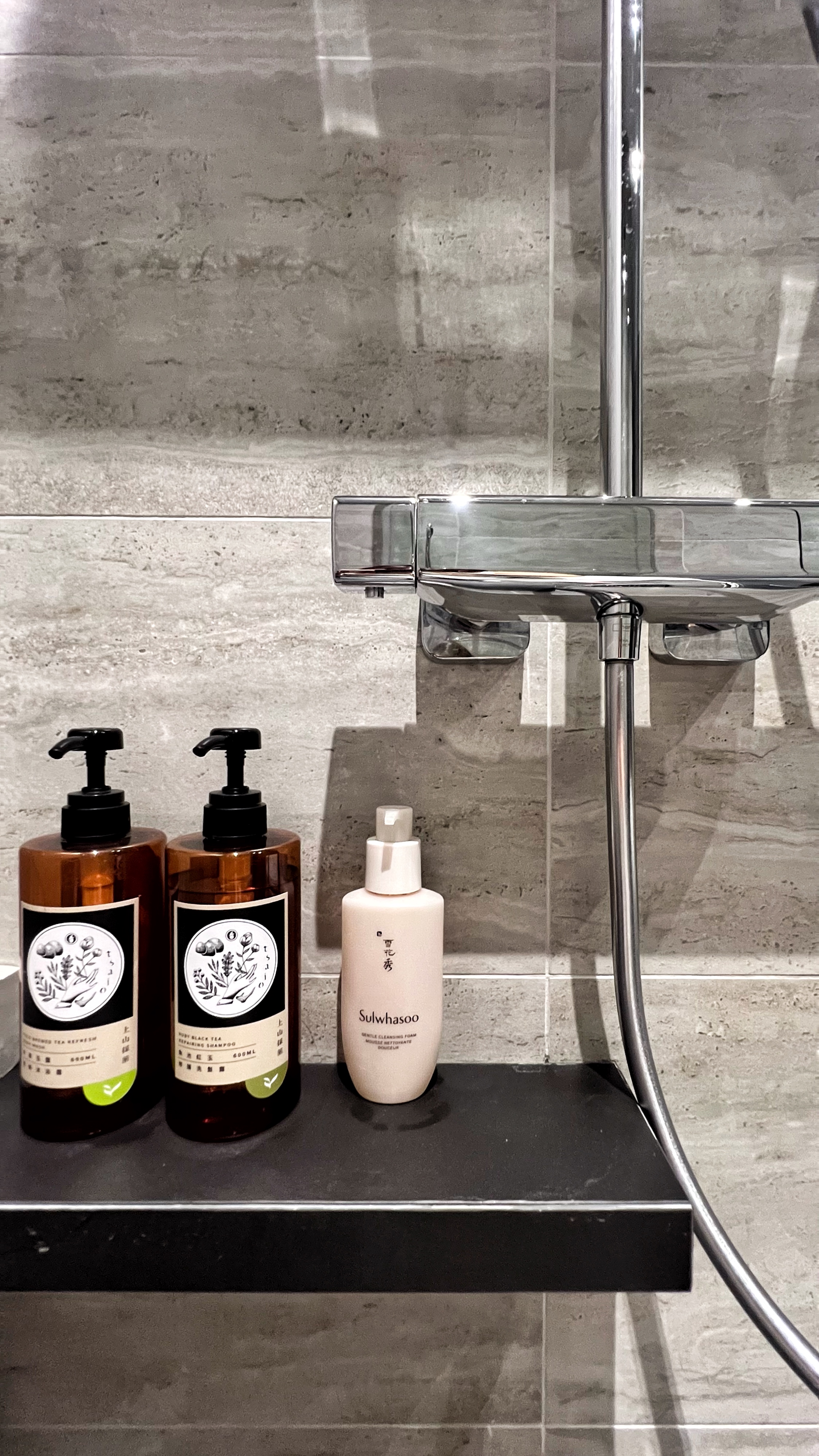 From Routine to Retreat: Crafting a Luxurious Bathroom Experience - Bathroom shelf, soap dispensers, black and white labels