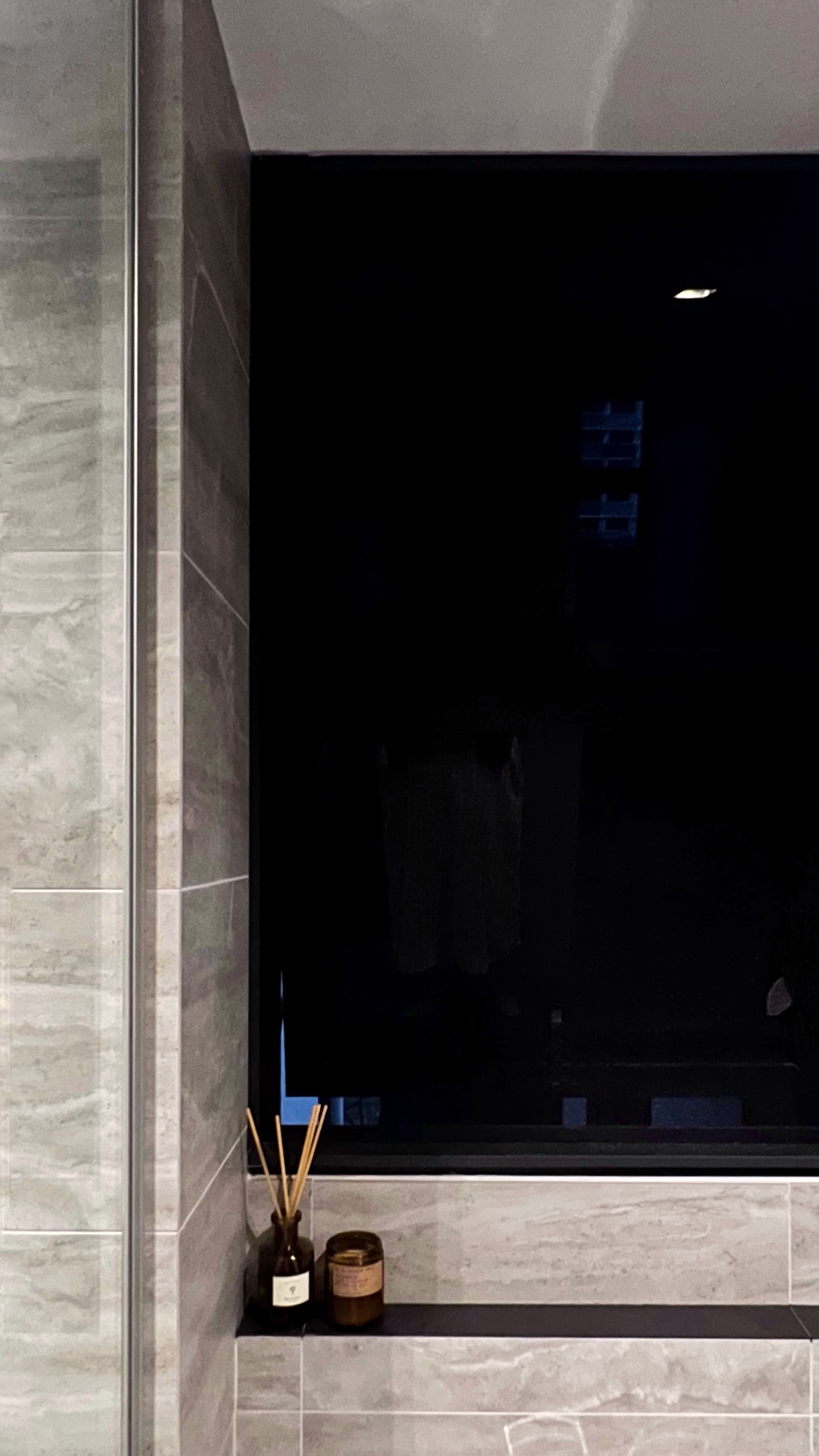 From Routine to Retreat: Crafting a Luxurious Bathroom Experience - Grey marble tiles, modern bathroom, dark window, wooden