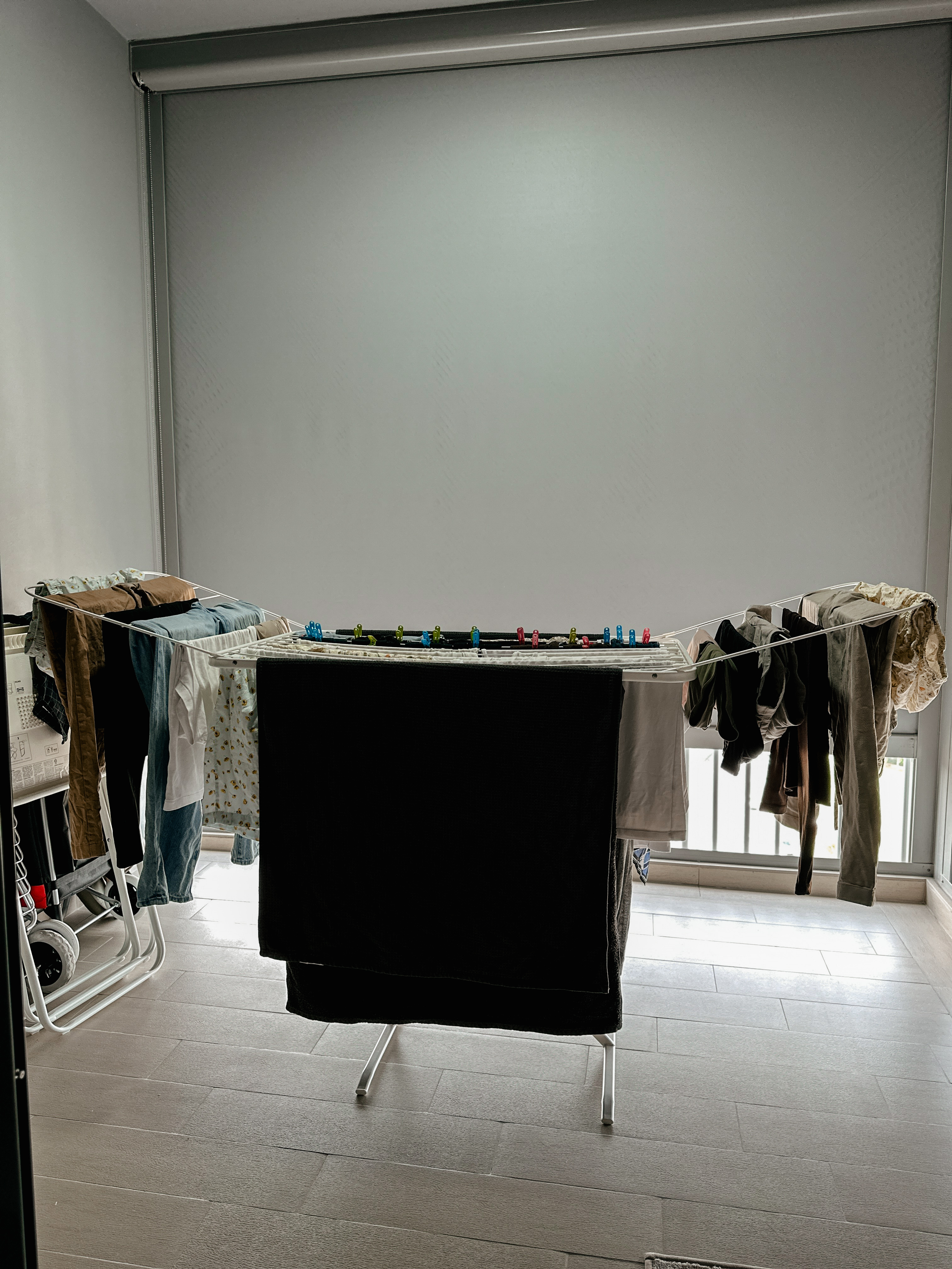 The ultimate space-saving solution in our minimalist rental apartment! - Dresser, clothes, drying, ironing board, clothes