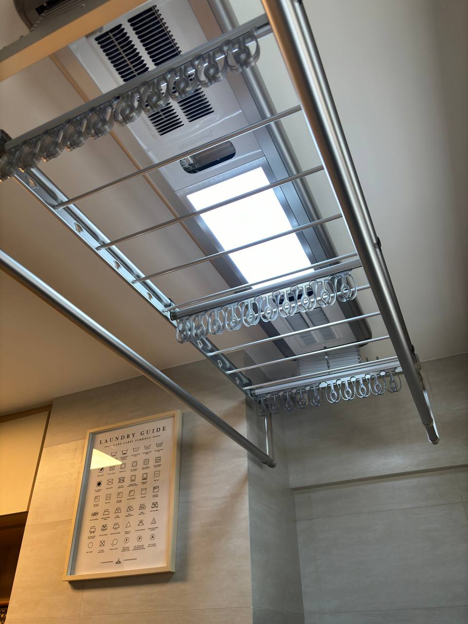 Simple & clutter-free Service Yard with zero built-ins - Metallic laundry rack, ceiling lights, ventilation ducts, metal