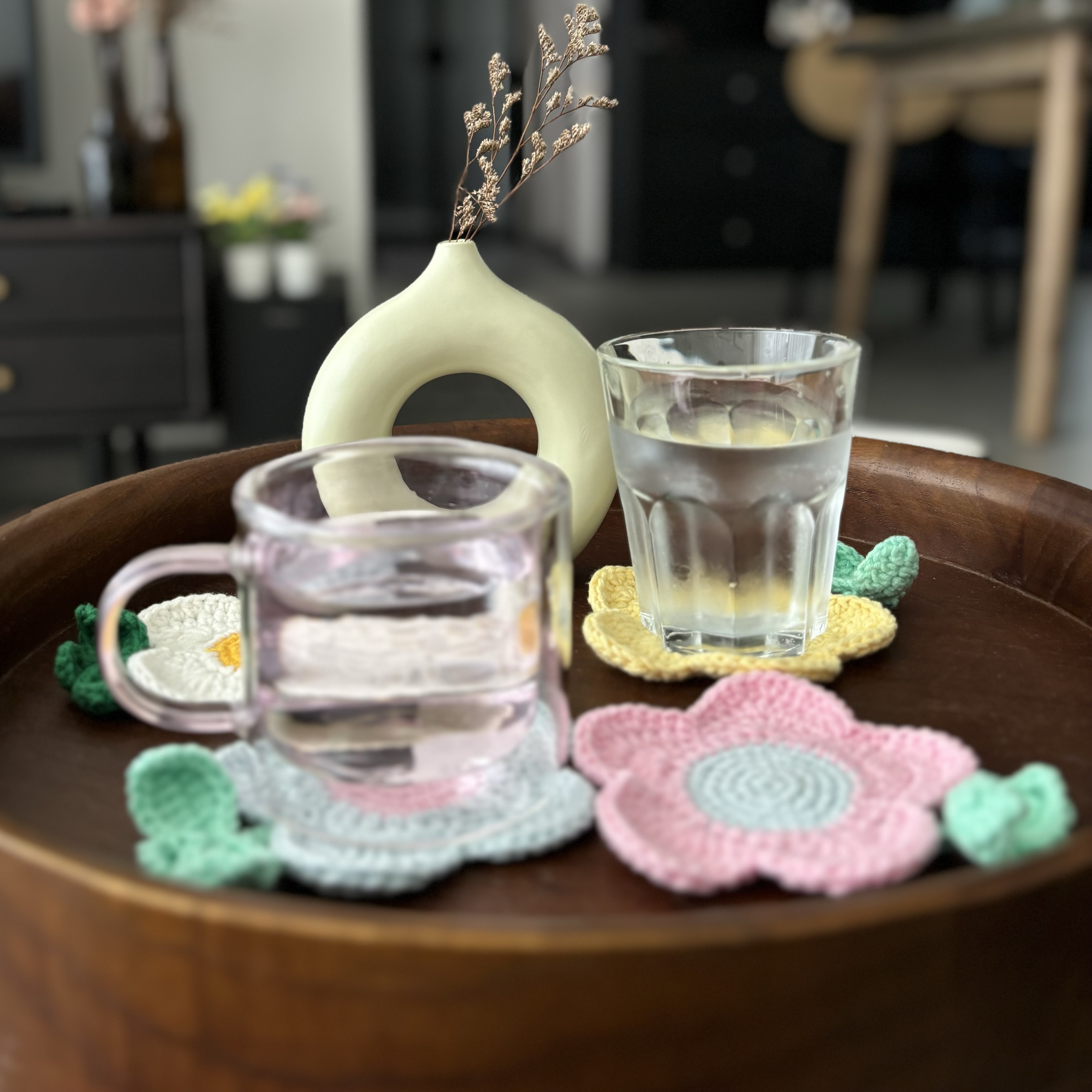 Easy ways to up your home aesthetic game! - vase with dried flowers, wooden tray, clear glass, crocheted coaster, pink and