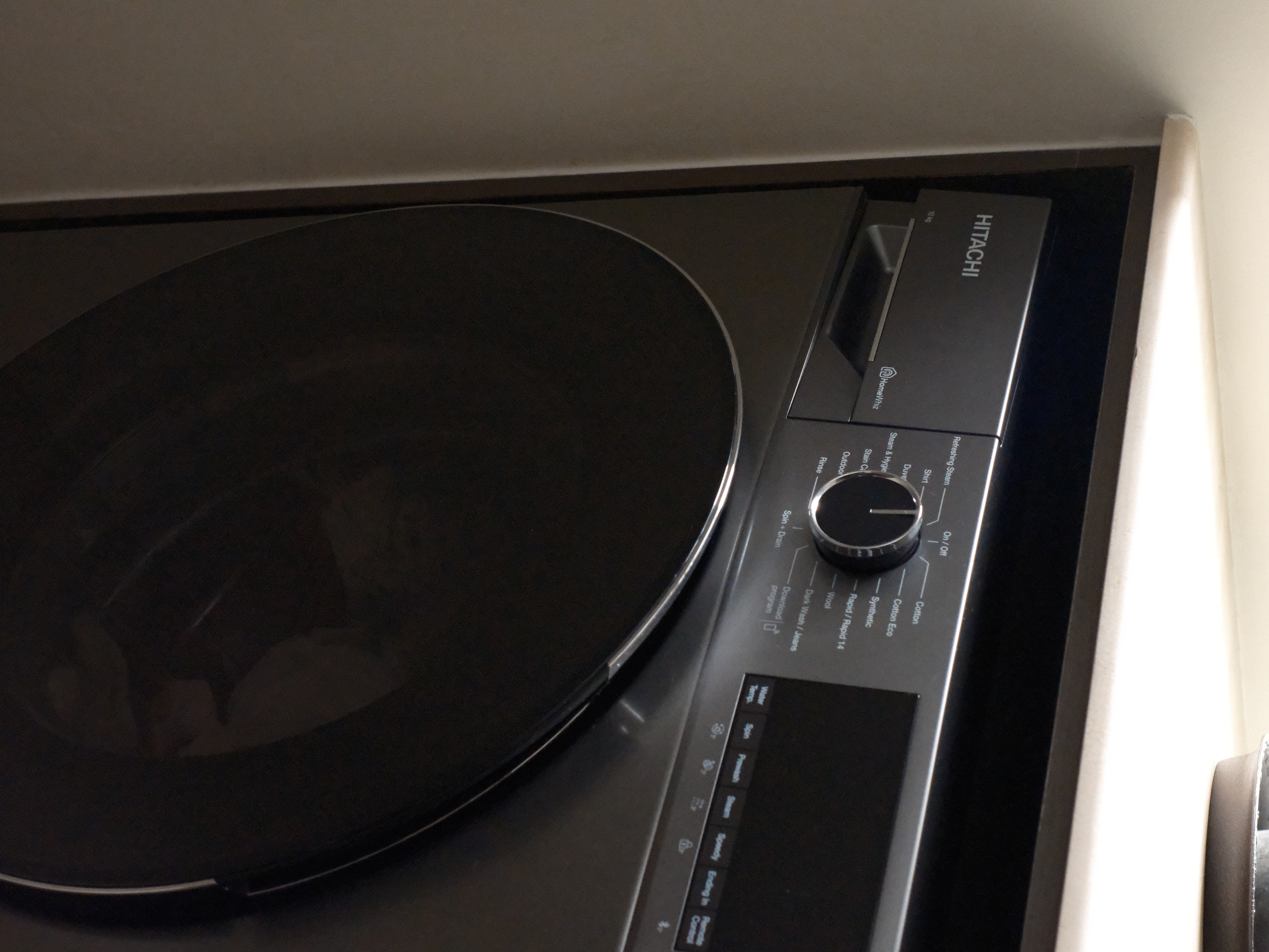 Service Yard: Laundry and Plant corner - Induction cooktop, Hitachi brand, control knob, stainless steel surface, modern