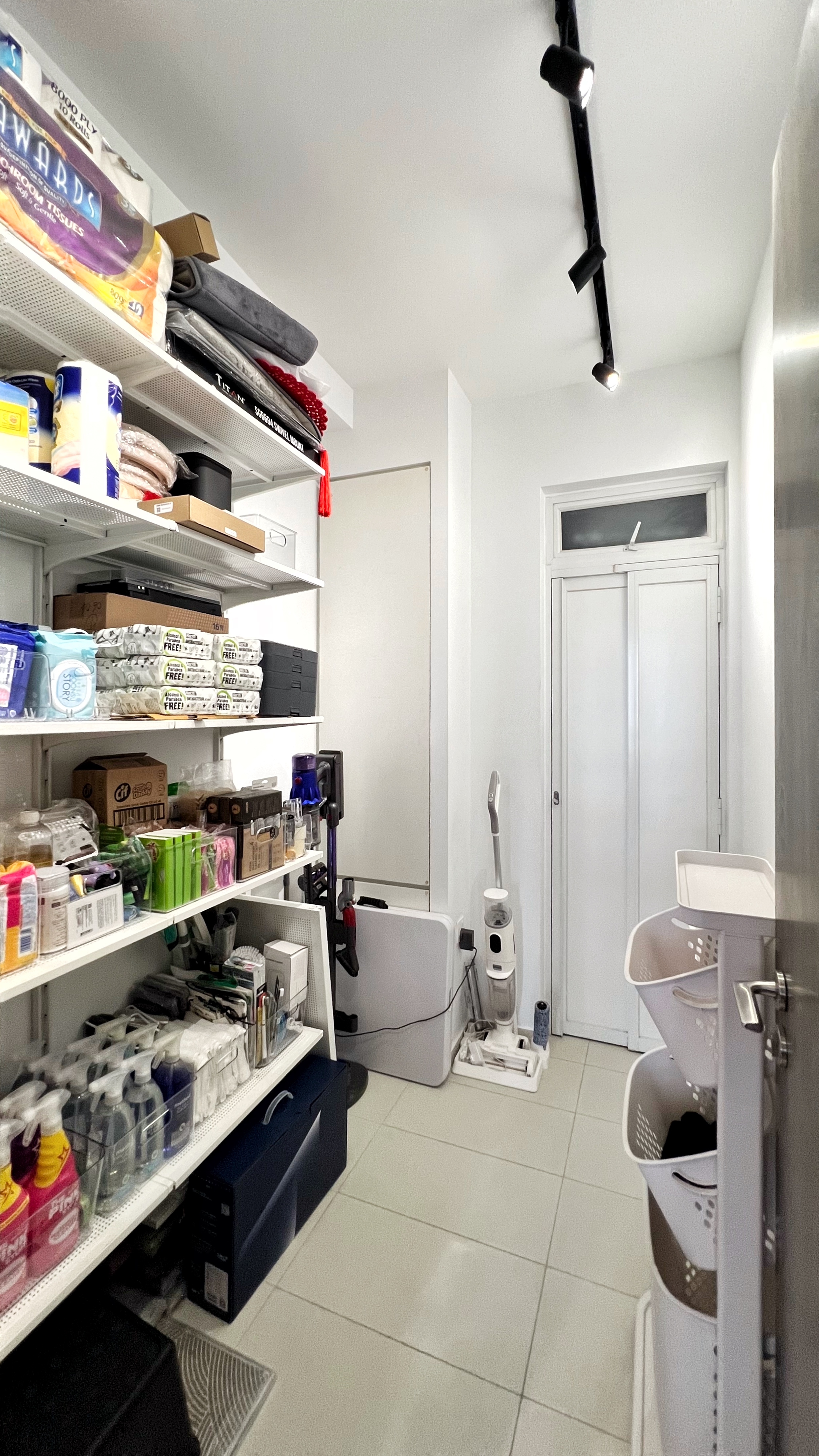 The Unsung Heroes: Where the Magic of Cleanliness Happens - Shelves stocked with various cleaning supplies, boxes, and