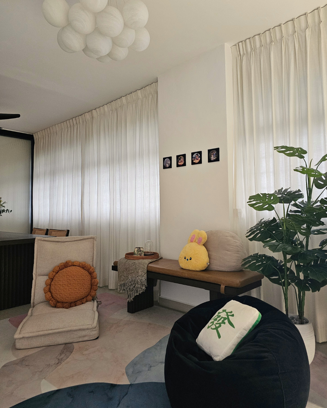 Our Cozy Area: 3 Ways Comfort Meets the Ground - Cream-colored armchair with orange cushion, beige chair with round cushion