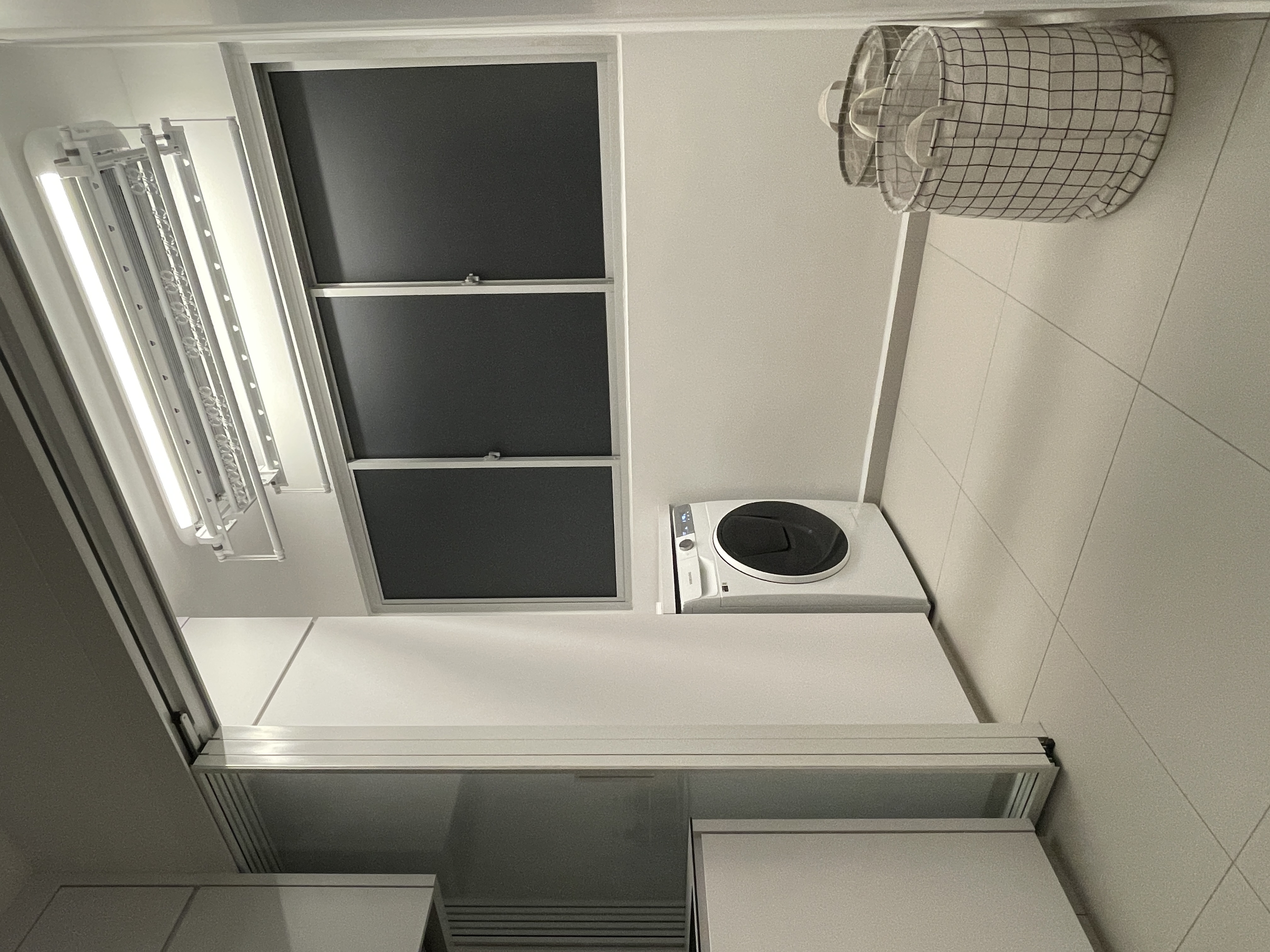 Service Yard: Clean, Spacious and Minimalist  - Mini fridge, compact kitchen, laundry unit, white appliances, tiled walls