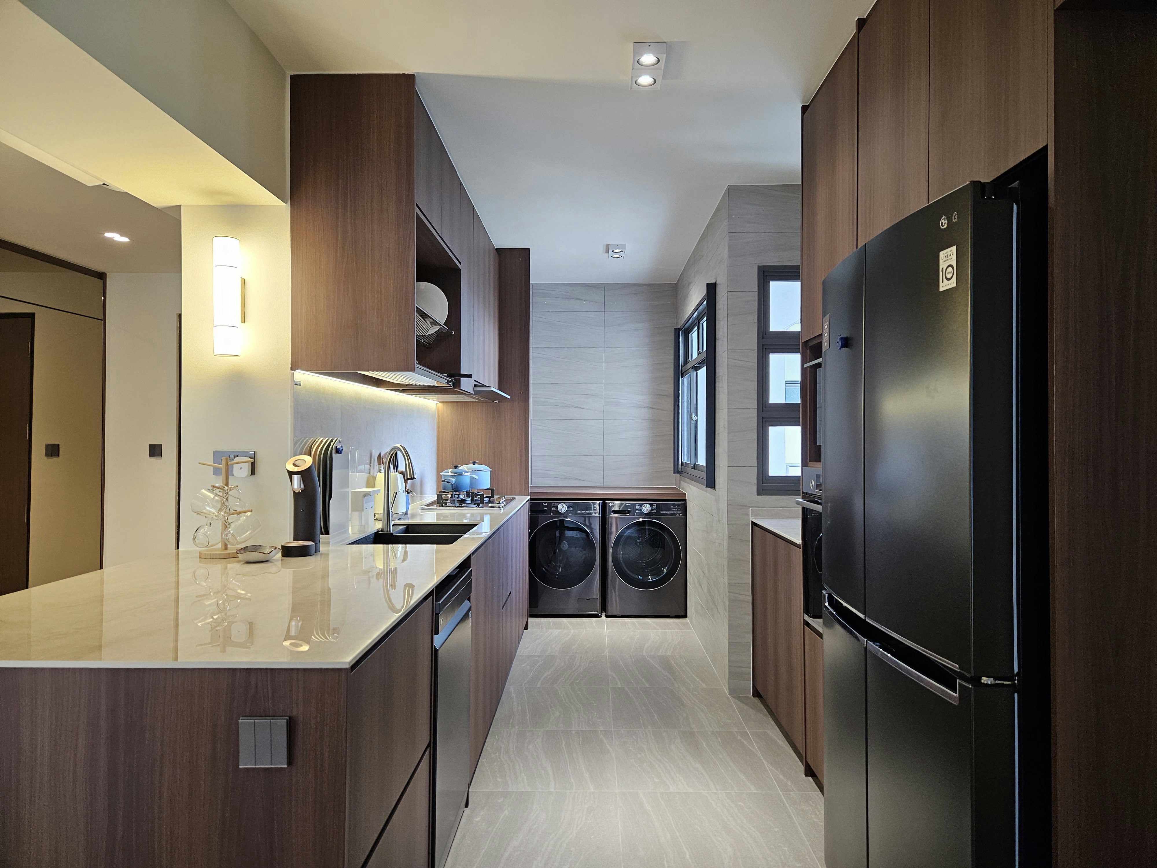 A Neat Home: Home Organisation! - Modern kitchen with sleek design, wooden cabinets, stainless steel appliances