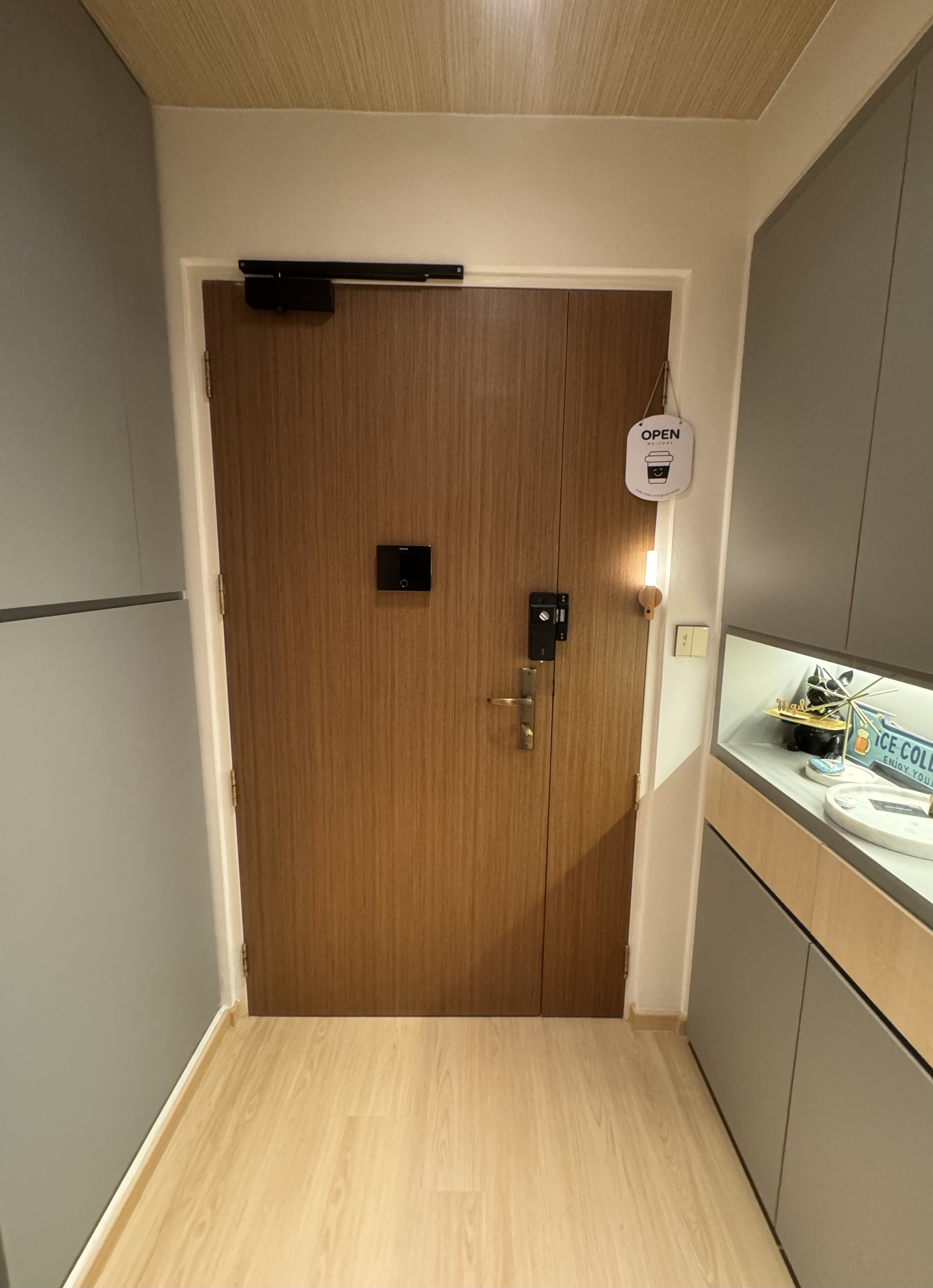 #NoRegrets Home Appliances - Wooden door, modern kitchen, light wood flooring, gray cabinets, black handle, open sign