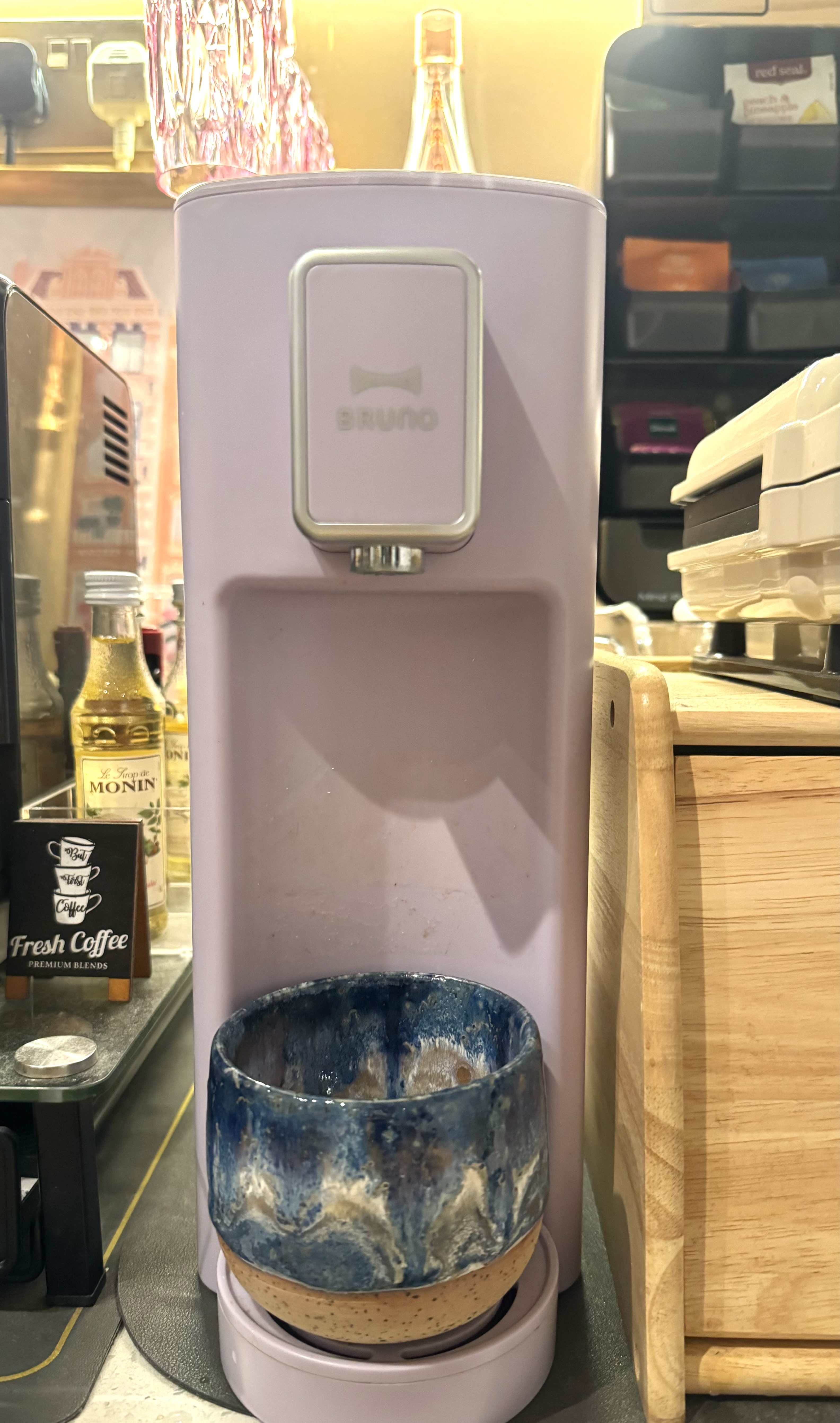 #NoRegrets Home Appliances - Lavish purple coffee machine with "Bruno" branding, Blue and white ceramic coffee bowl under the