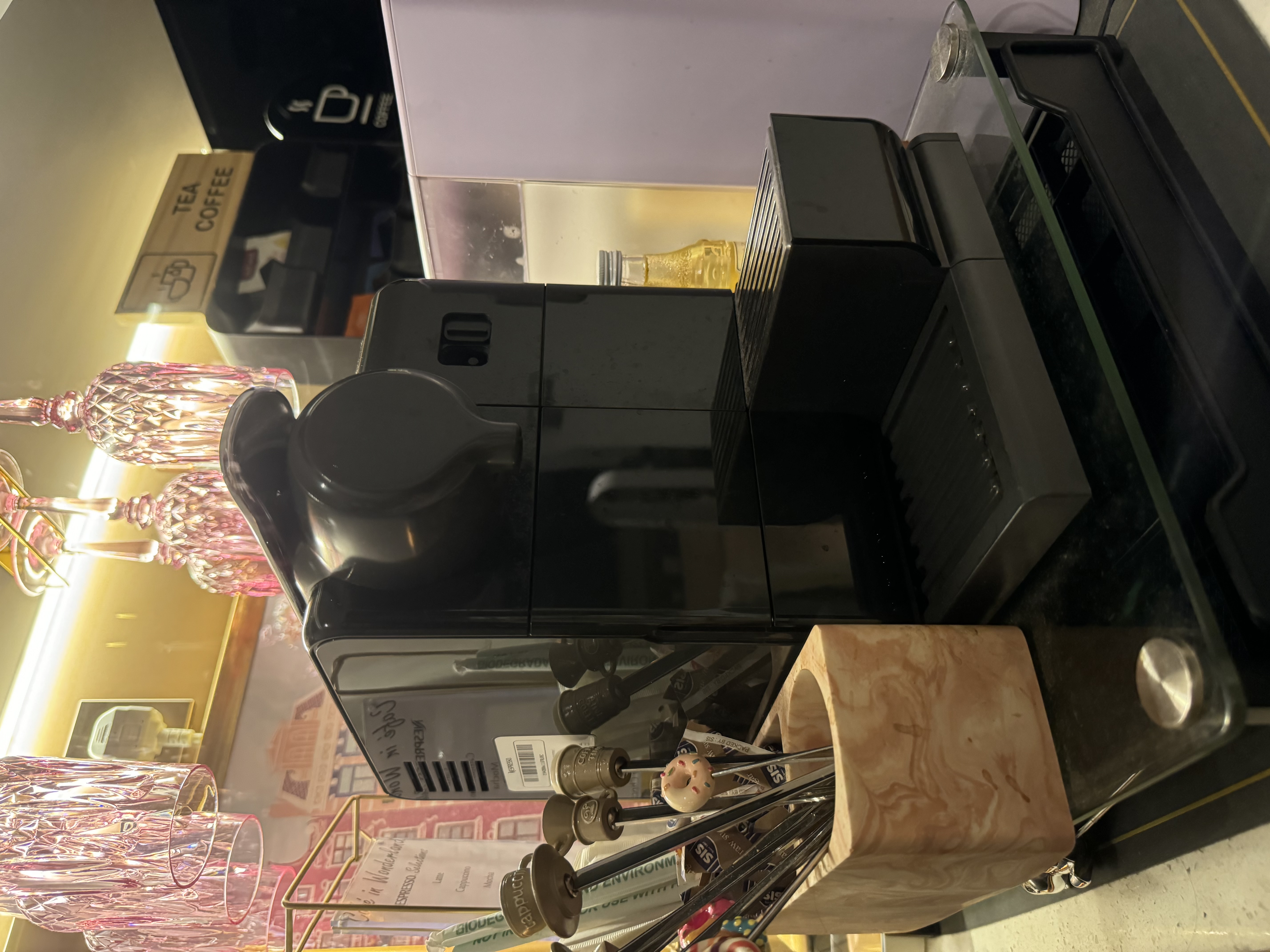 #NoRegrets Home Appliances - vibrant glass cups, coffee machine, espresso machine, coffee beans, donut-shaped utensil, wooden