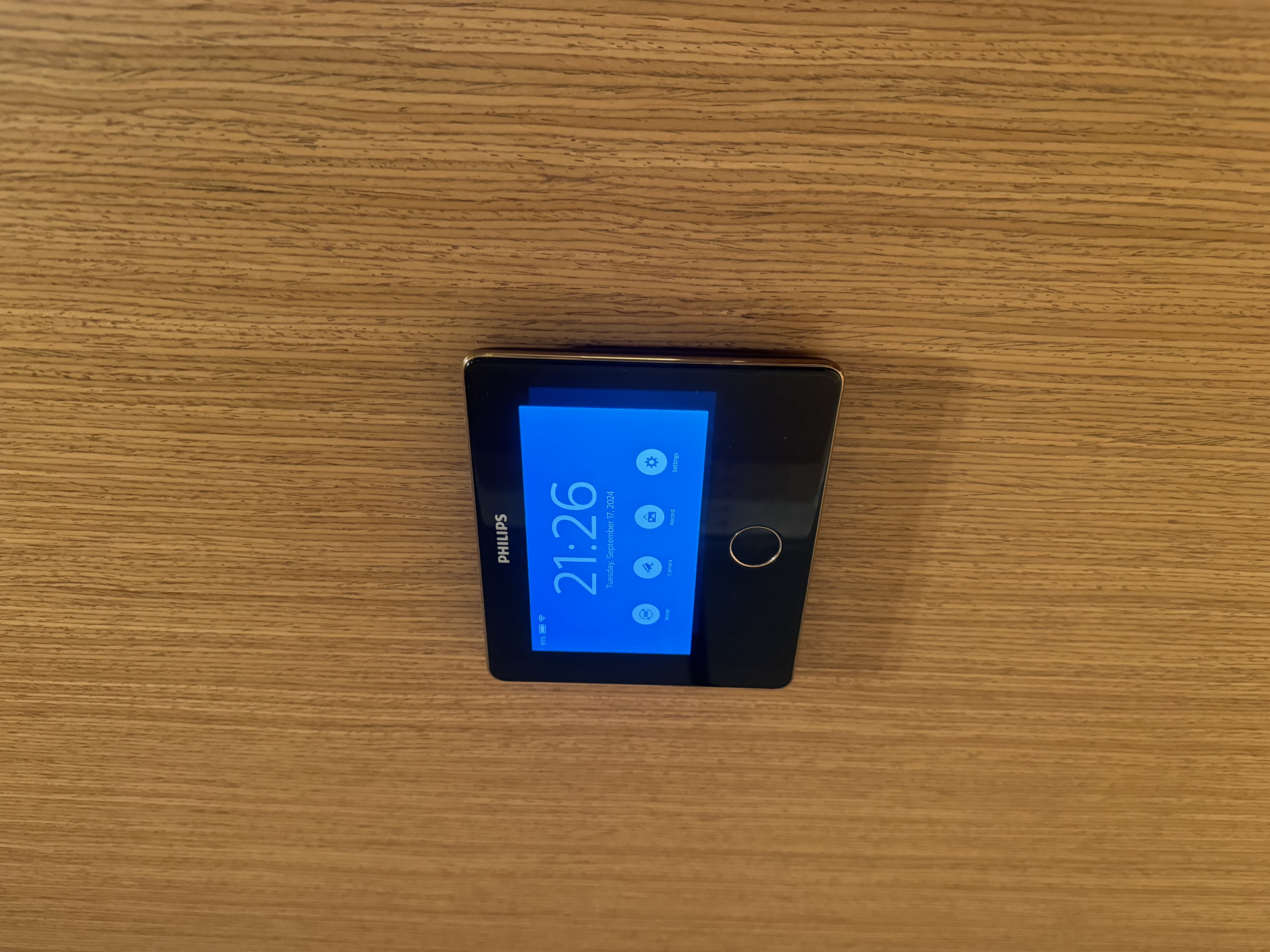 #NoRegrets Home Appliances - Black Philips tablet on wooden surface, Blue screen displaying time and date, Smartphone with