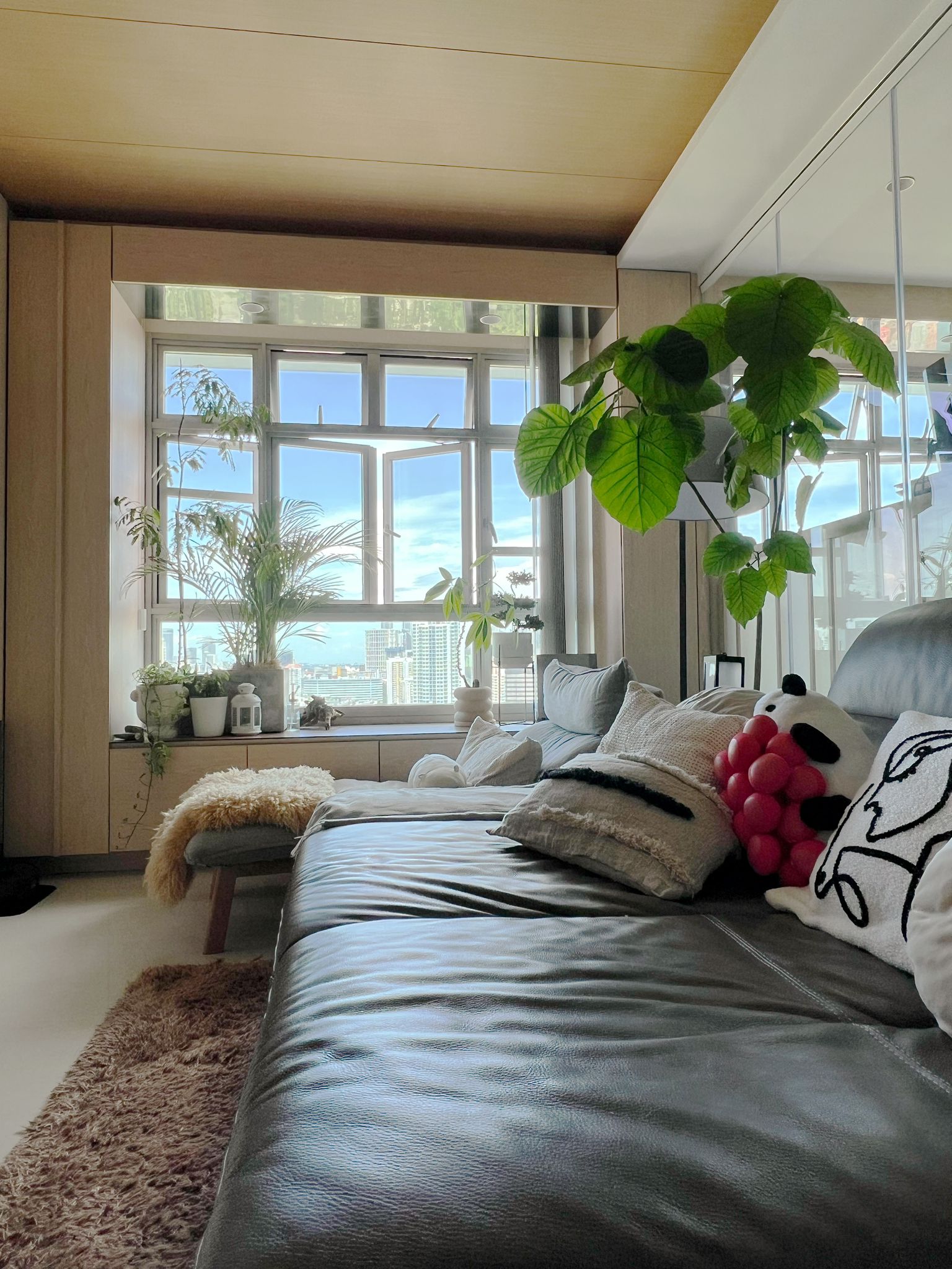 Investing in Clean: Our Game-Changing Robot Vacuum and Mop! - Modern living room, cozy seating area, large window, natural