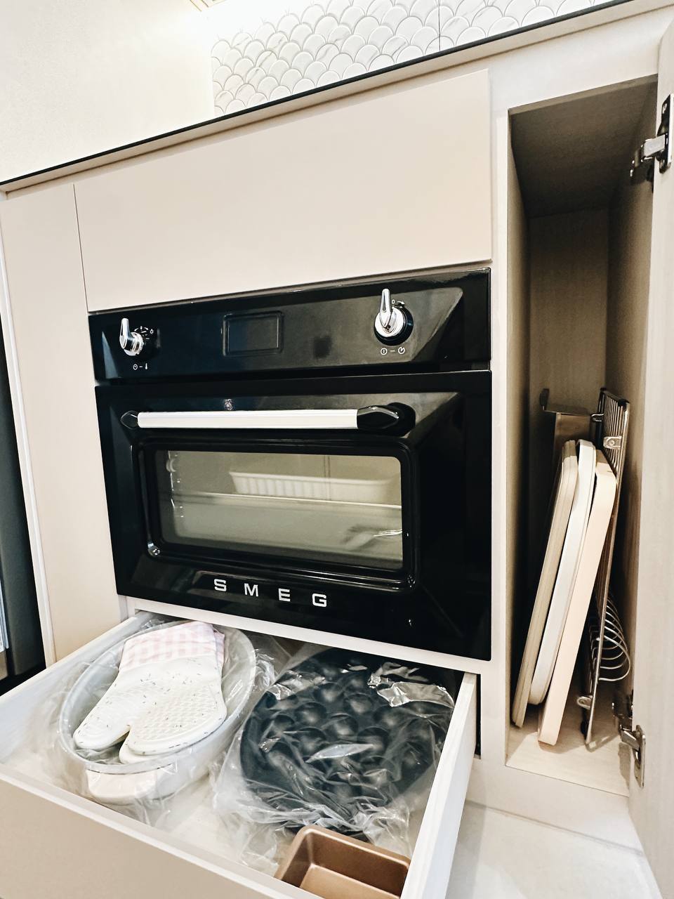 Our Kitchen Organization Tip: Hide the clutter!  - Miniature oven, sleek design, black and white color scheme, built-in oven