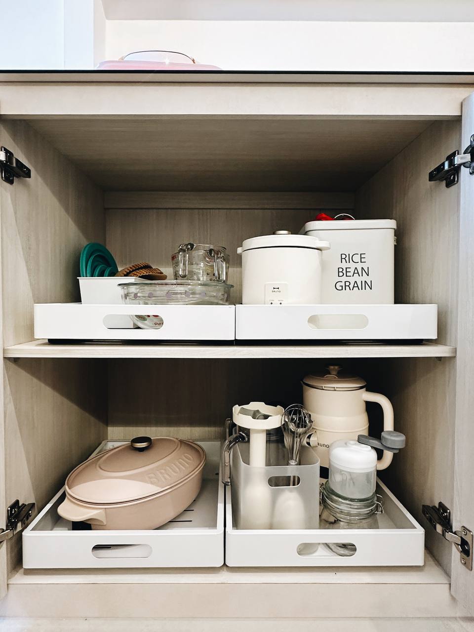 Our Kitchen Organization Tip: Hide the clutter!  - White kitchen cabinet, neatly organized, dual drawers, rice cooker, bean