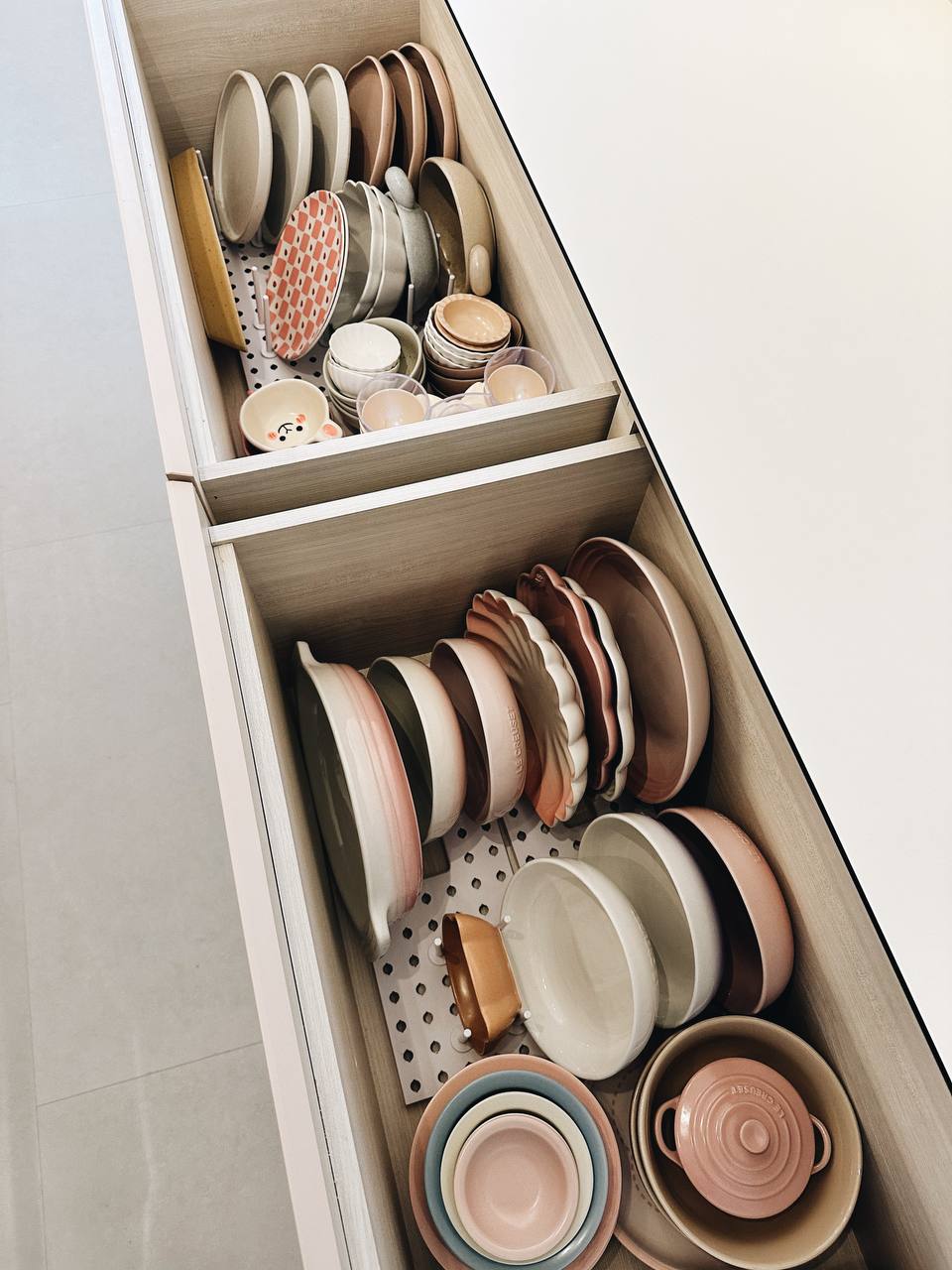 Our Kitchen Organization Tip: Hide the clutter!  - Durable kitchenware, organized storage, ceramic plates, wooden drawer