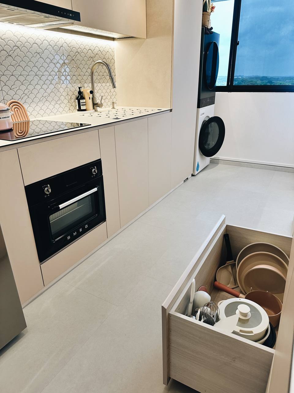 Our Kitchen Organization Tip: Hide the clutter!  - Modern kitchen with sleek design, beige cabinets, integrated oven