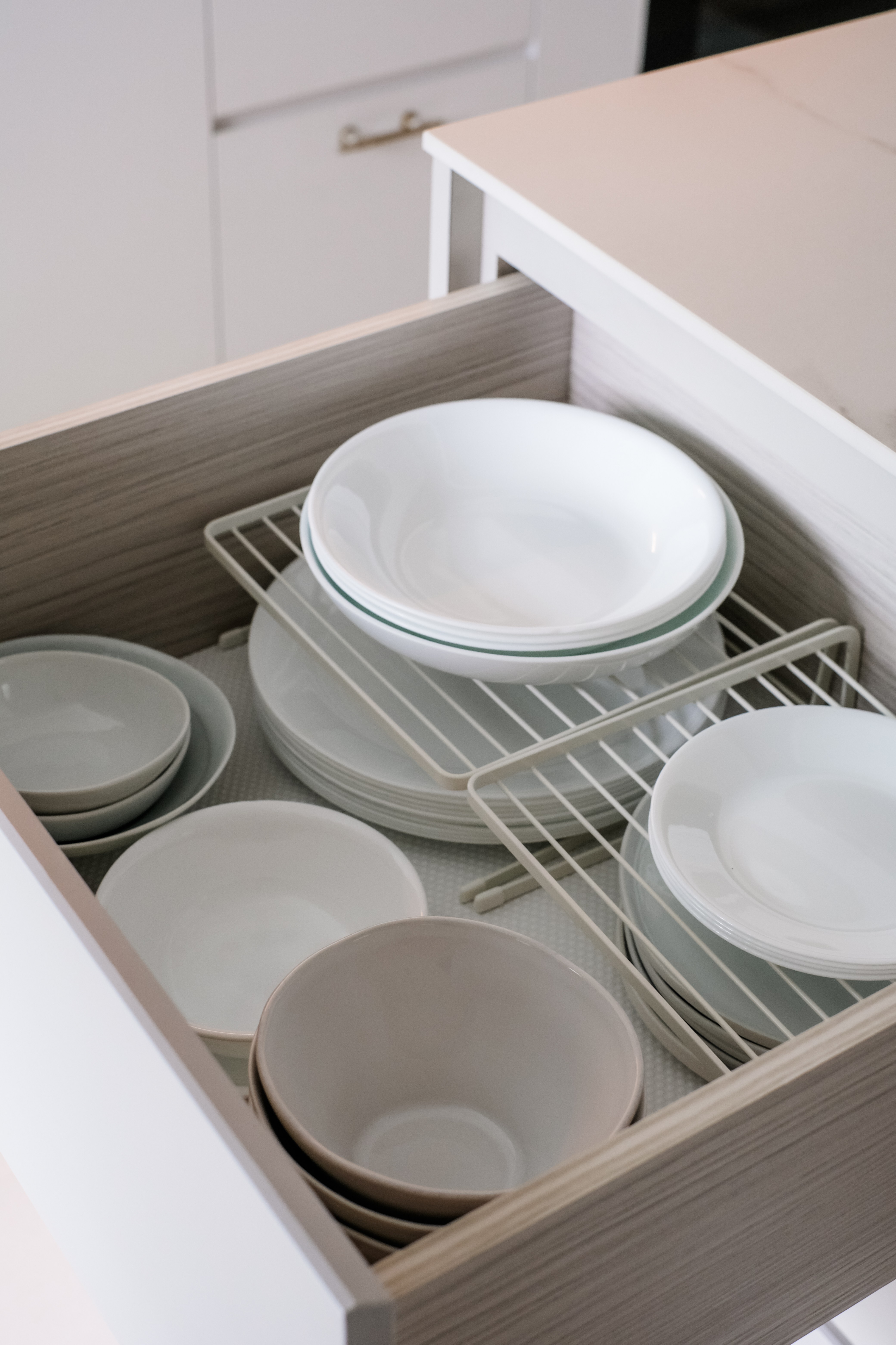 Effortless Kitchen Organization : Keep It Clean and Clutter-Free - Dishwasher drawer, neatly organized dishes, white ceramic