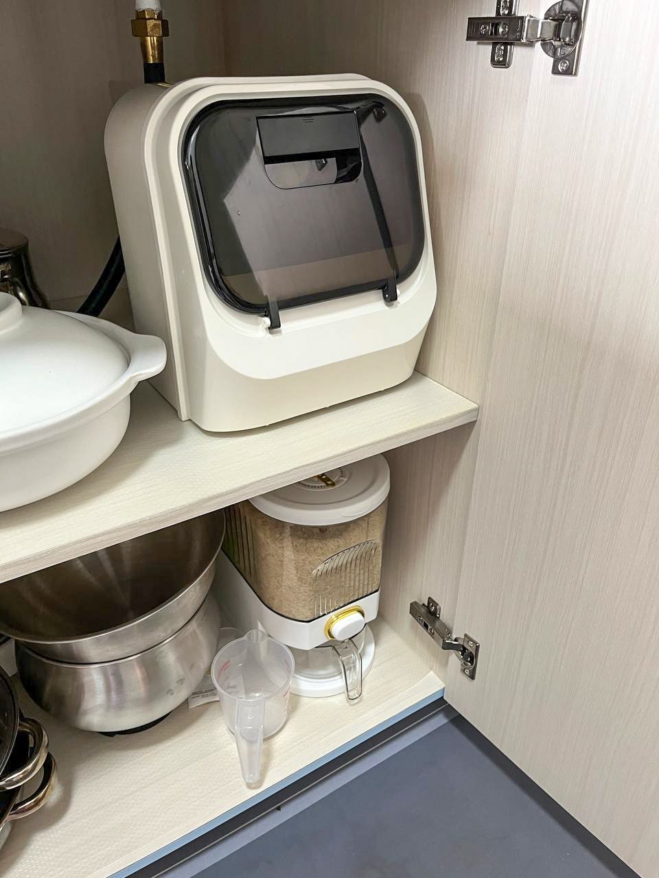 A peep into our kitchen cabinets!  - White toaster with glass window, stainless steel pot, rice cooker, measuring cup