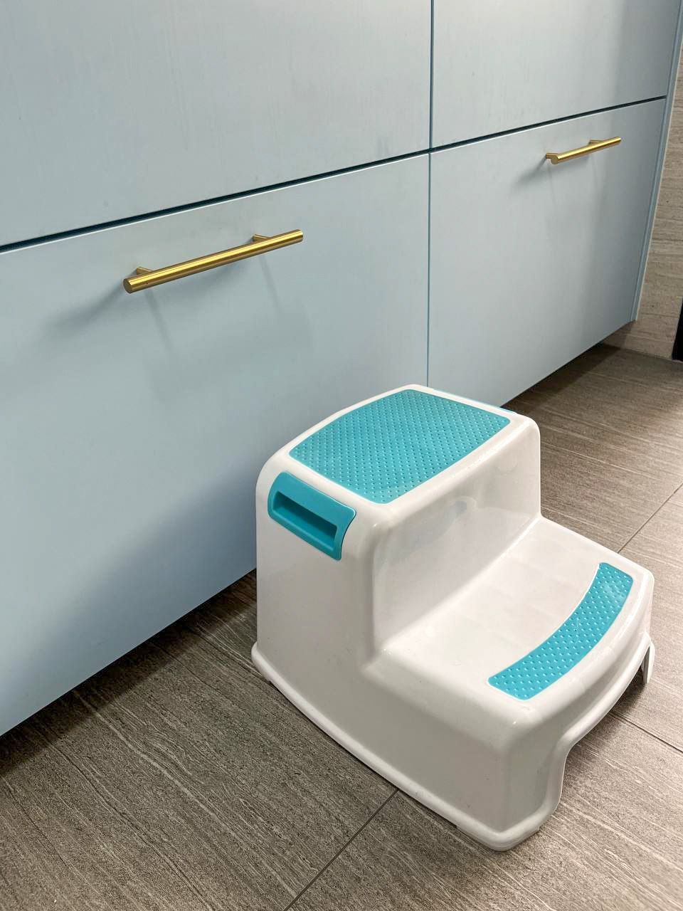 A peep into our kitchen cabinets!  - Step stool with blue accents, modern kitchen cabinet, child-sized step stool, white and