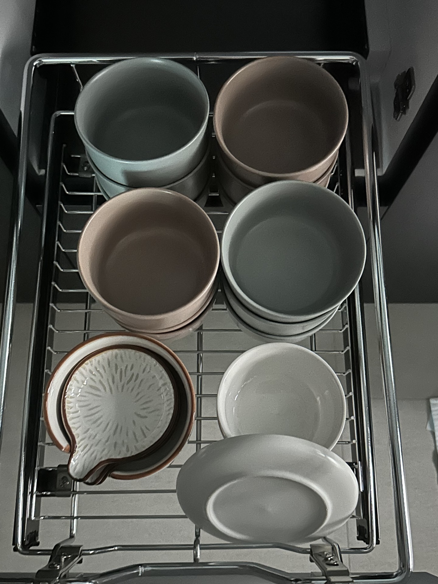 Kitchen Organisation: Streamlined Kitchen Essentials - Dishwasher rack, neatly organized dishes, white ceramic bowls, brown