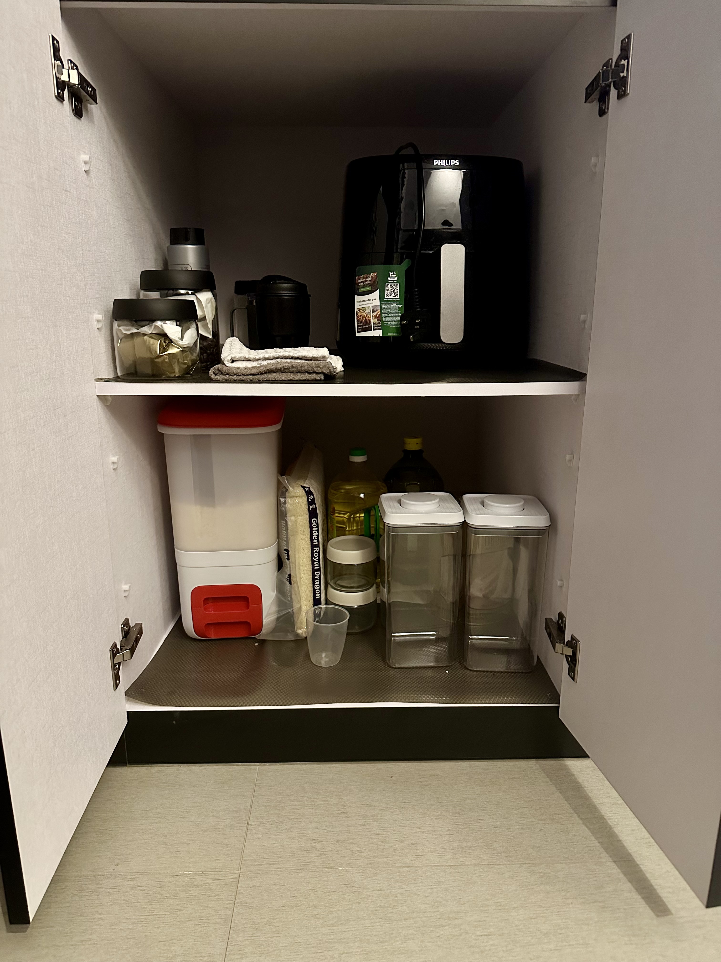 Kitchen Organisation: Streamlined Kitchen Essentials - Organized kitchen cabinet, white shelves, black coffee maker