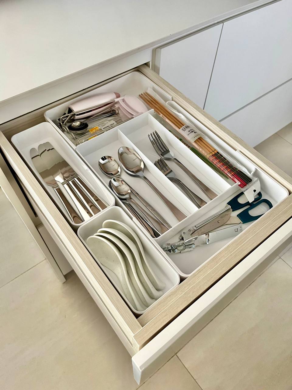 Kitchen Organisation and Reno Regret - Organized drawer, neatly arranged utensils, stainless steel forks, silver cutlery