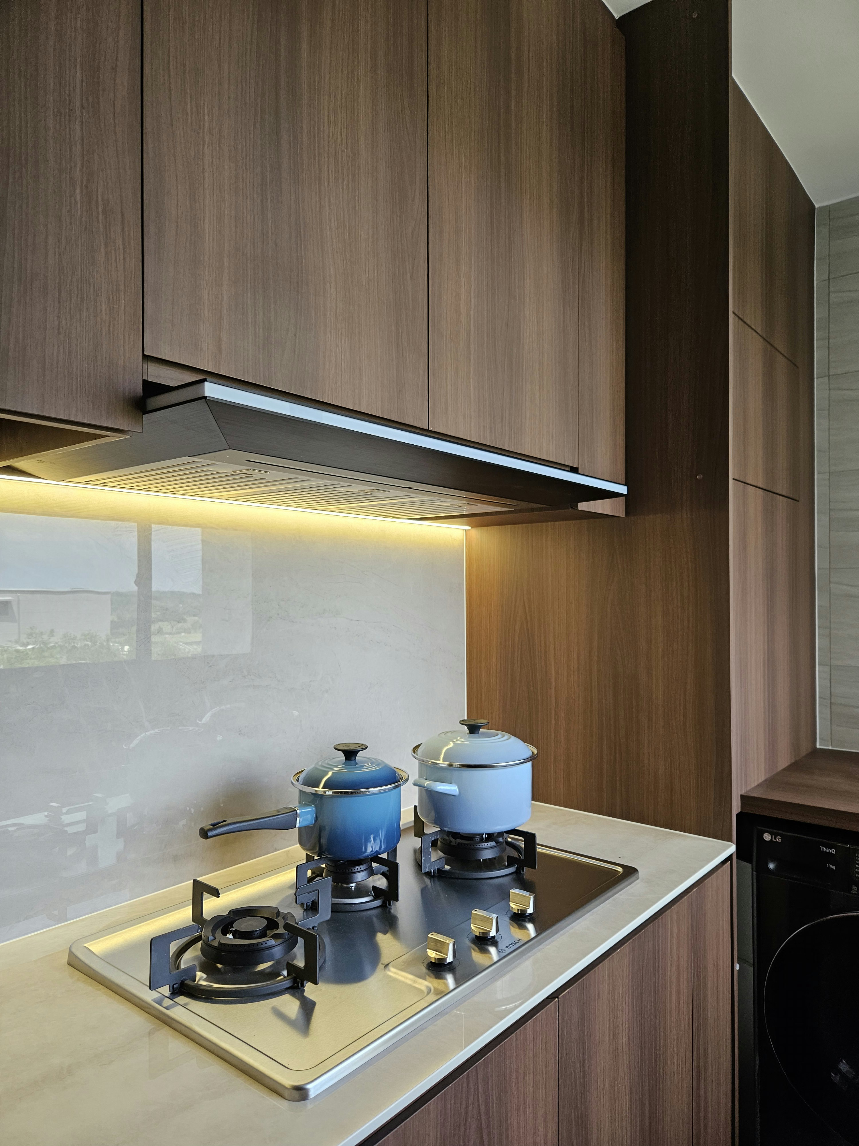 Kitchen Organisation: Our Favourite Storage Solutions - Wooden kitchen cabinets, modern stove, blue pots, gas stove