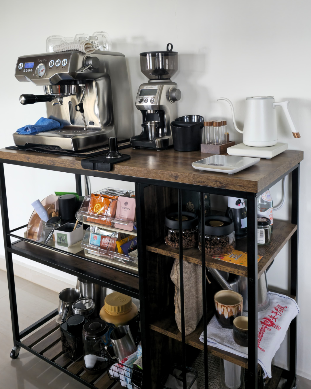 Home Vibes FAQ: Why We Sit on the Floor & Hide Our Clothes - stainless steel espresso machine, coffee grinder, coffee beans