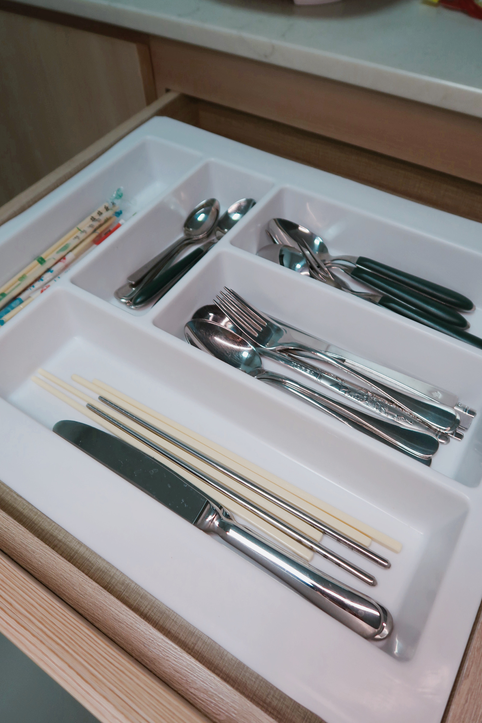 Our Enclosed Kitchen Organisation With Plenty Storage  - silverware tray, neatly organized, stainless steel utensils, wooden