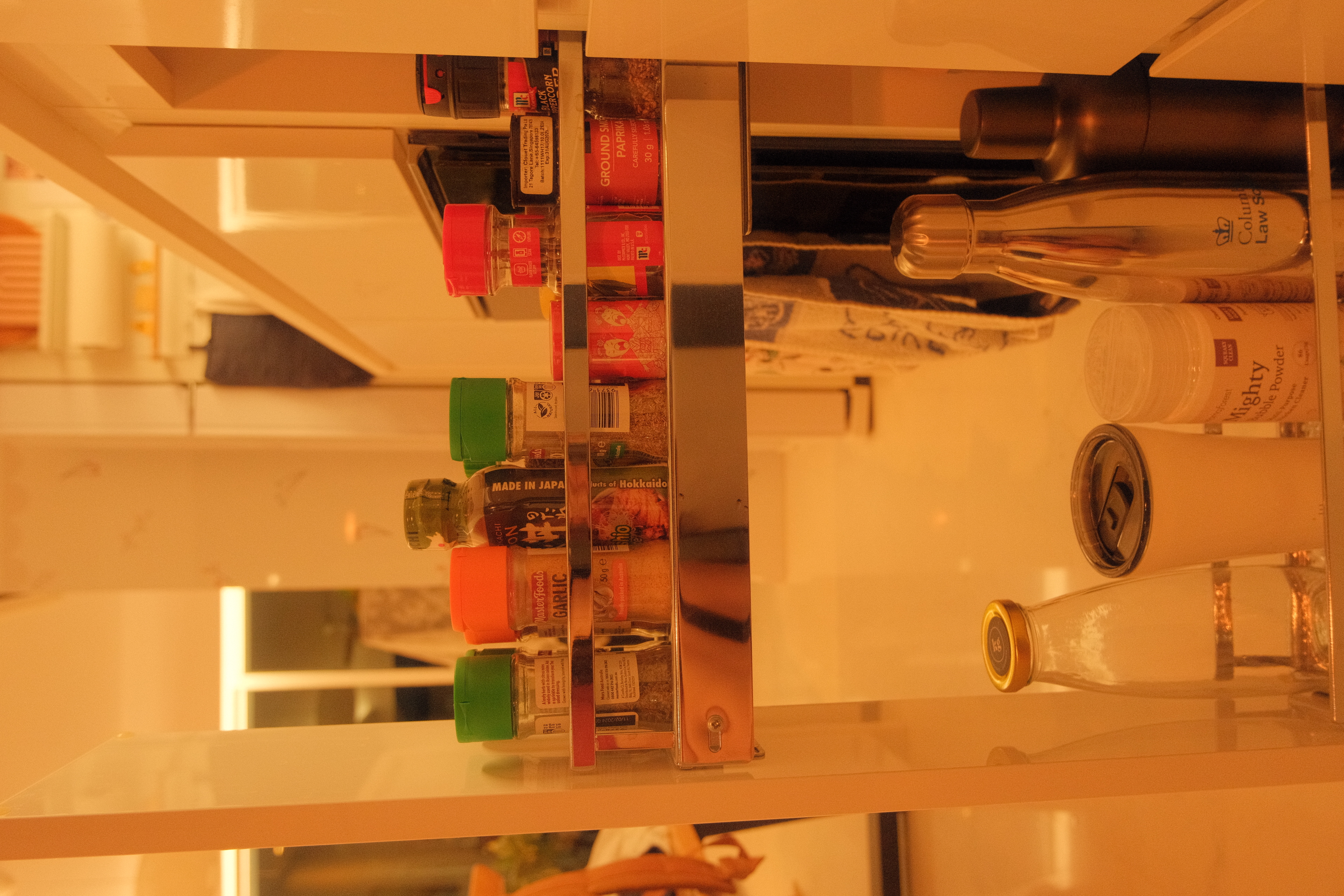 Check out how I Marie Kondo-ed my Kitchen  - Shelf stocked with various condiments, including spices and seasonings, in a