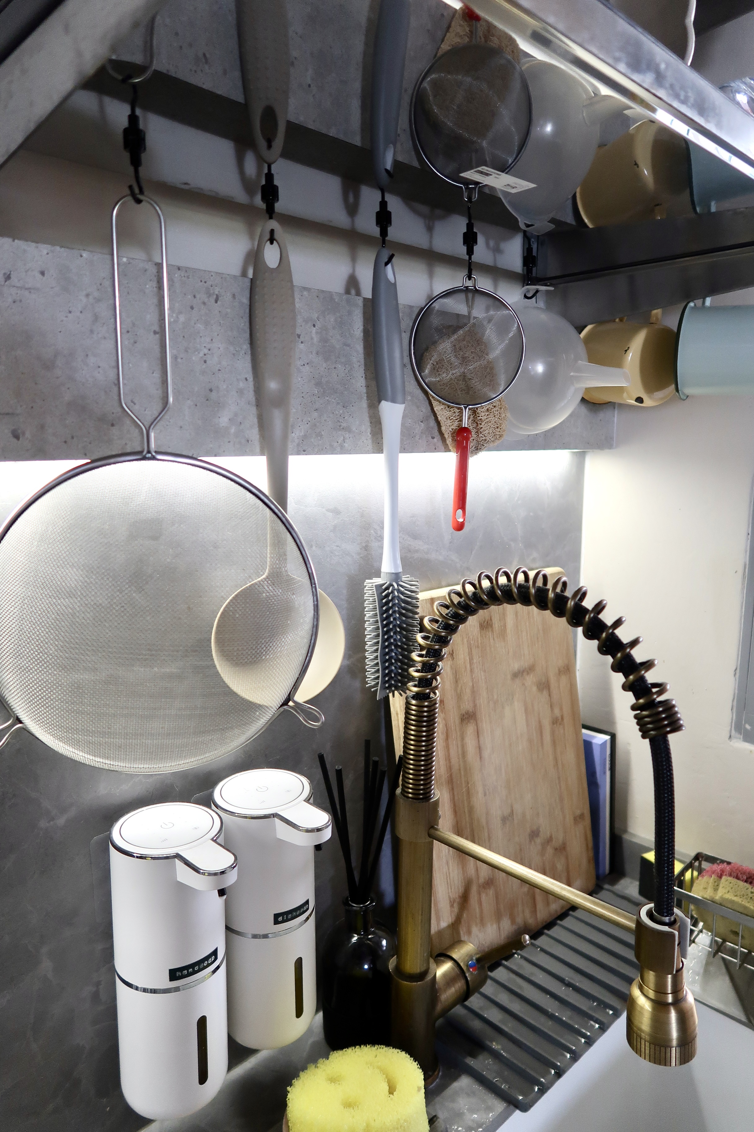 Affordable Ways We Organise Our Minimal Kitchen - Kitchen sink area, stainless steel faucet, white kitchen utensils, metal