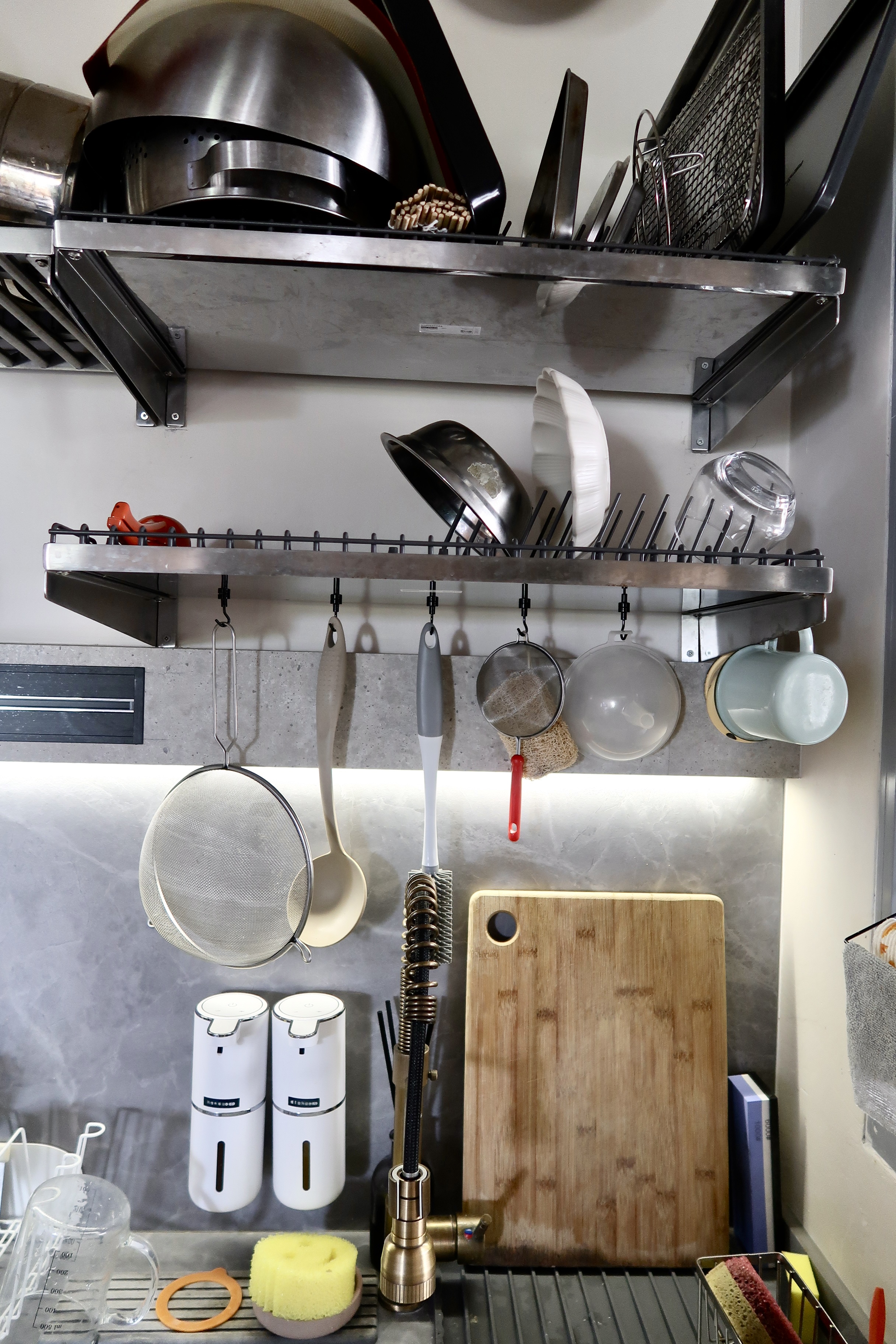 Affordable Ways We Organise Our Minimal Kitchen - stainless steel kitchen rack, hanging utensils, metal strainer, glass jar