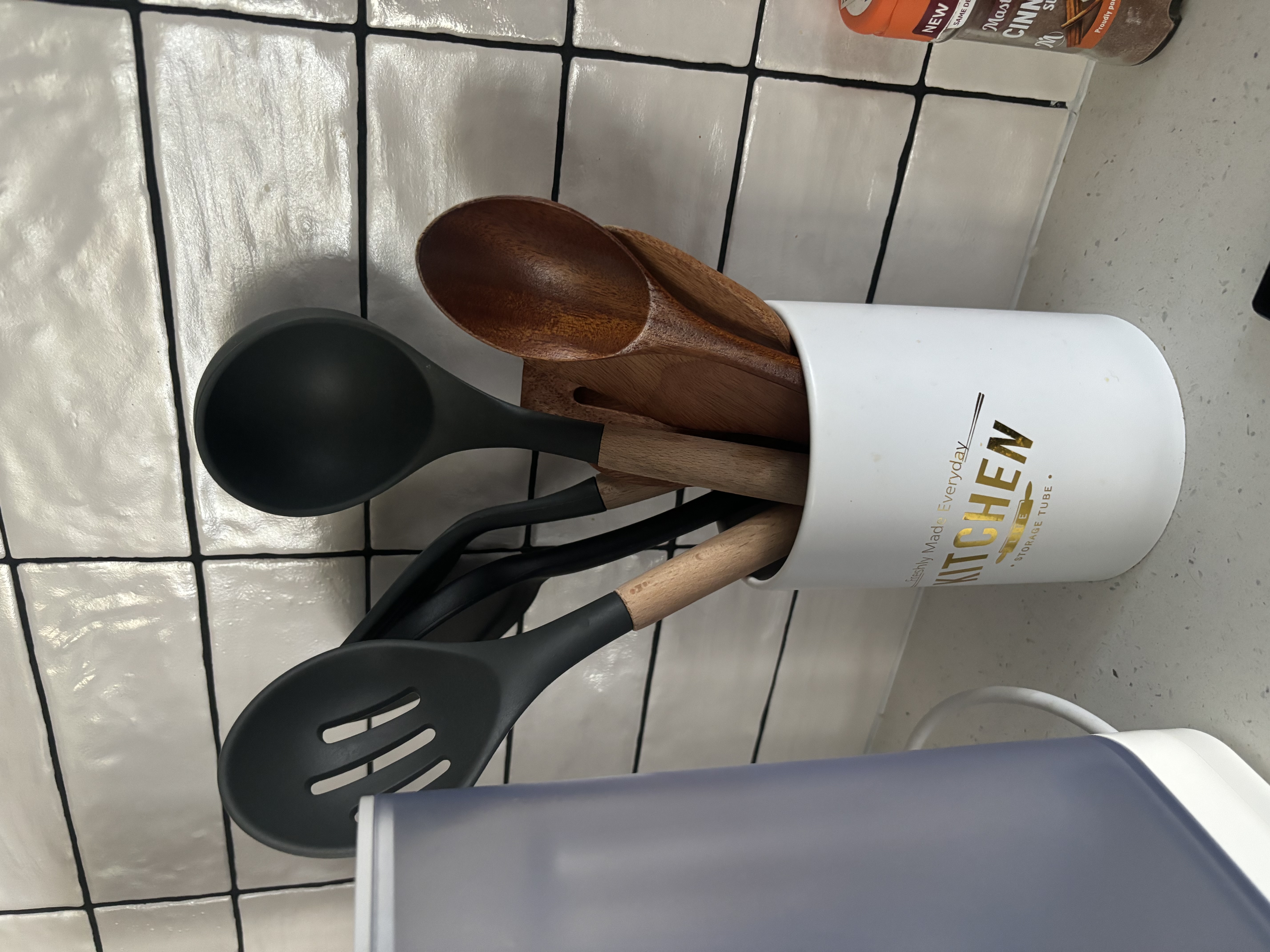 Tips and Tricks for a Functional and Organised Kitchen  - wooden kitchen utensils, black ladle, stainless steel spoon, white