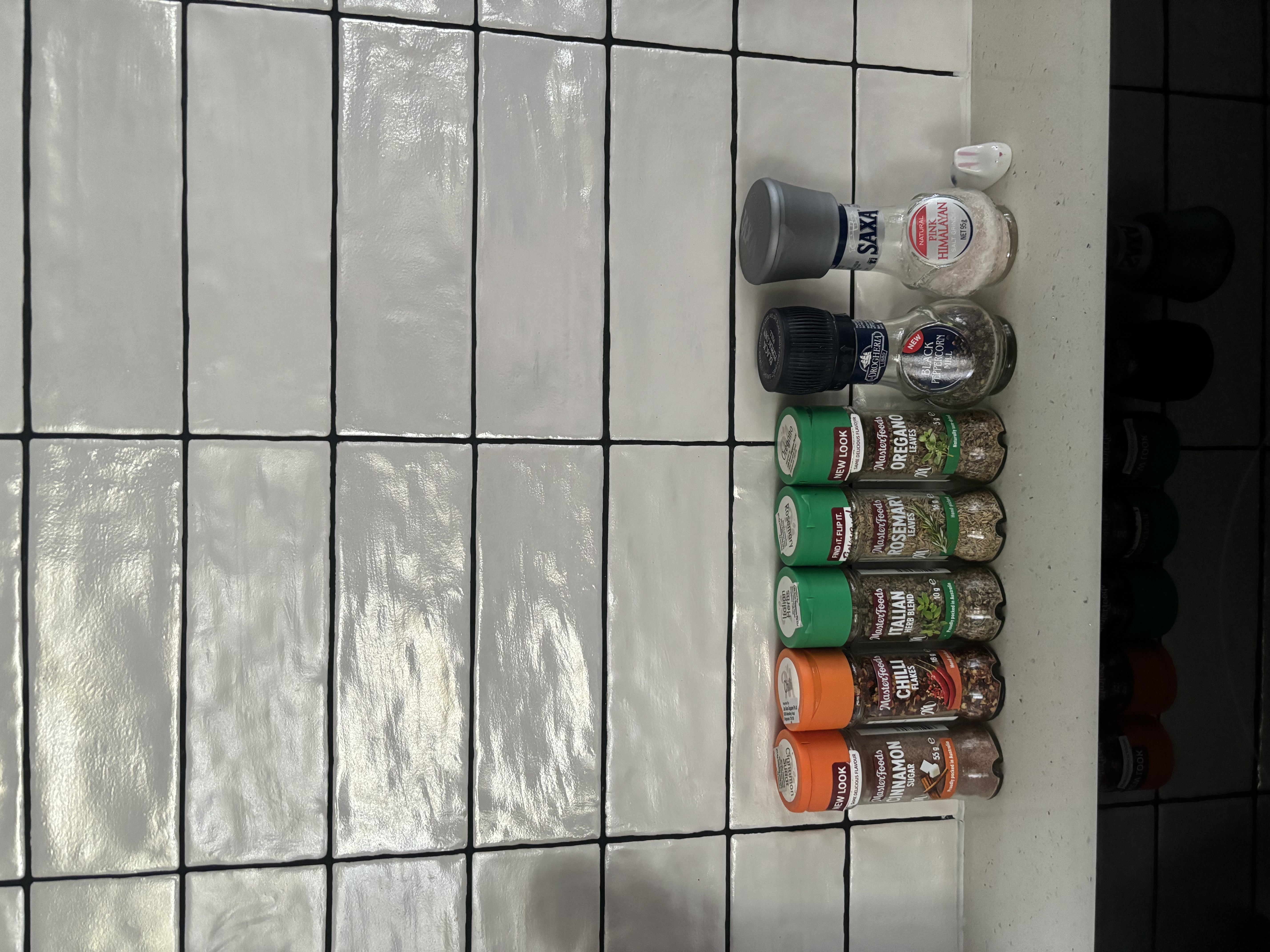 Tips and Tricks for a Functional and Organised Kitchen  - White tiled floor, kitchen countertop, spice jars, herbs, spices