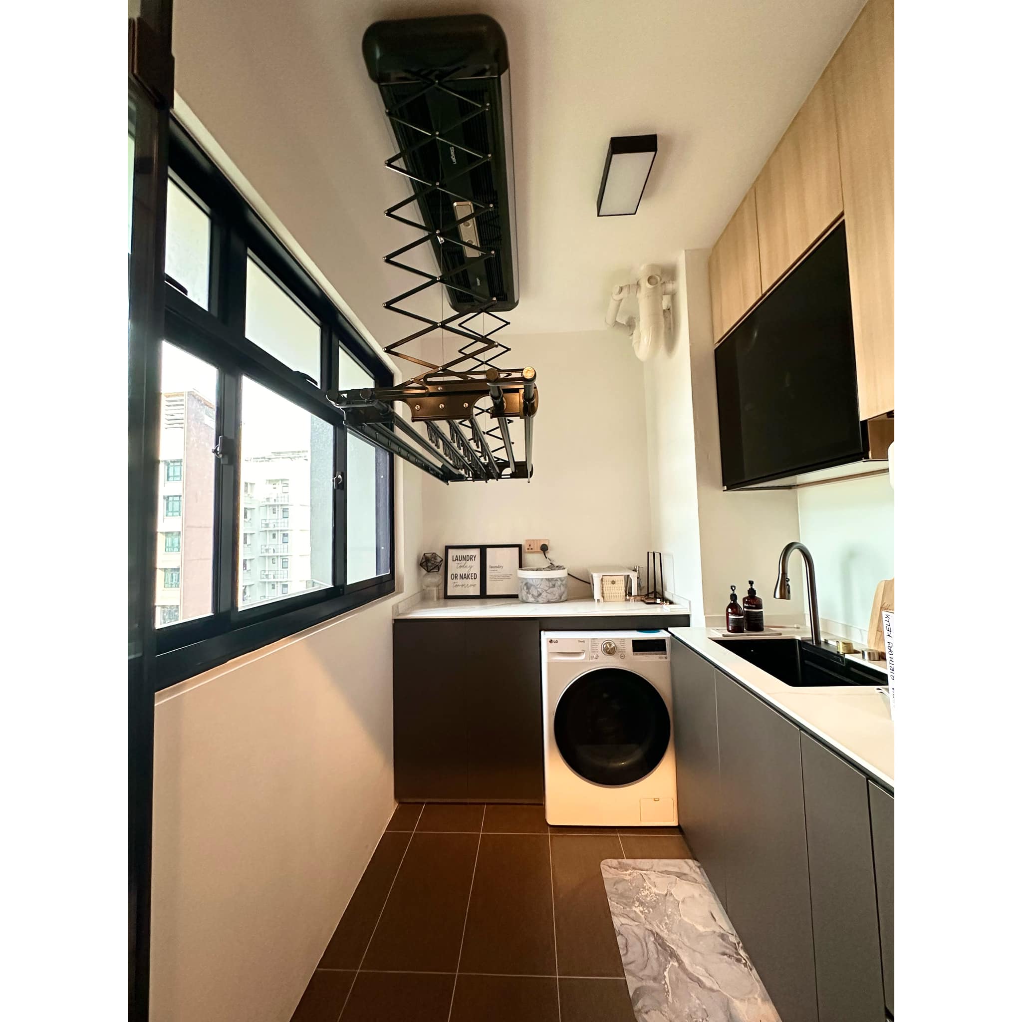 Maximising A Small Yet Functional Service Yard In Our Kitchen - Modern laundry room with built-in sink and countertop, black