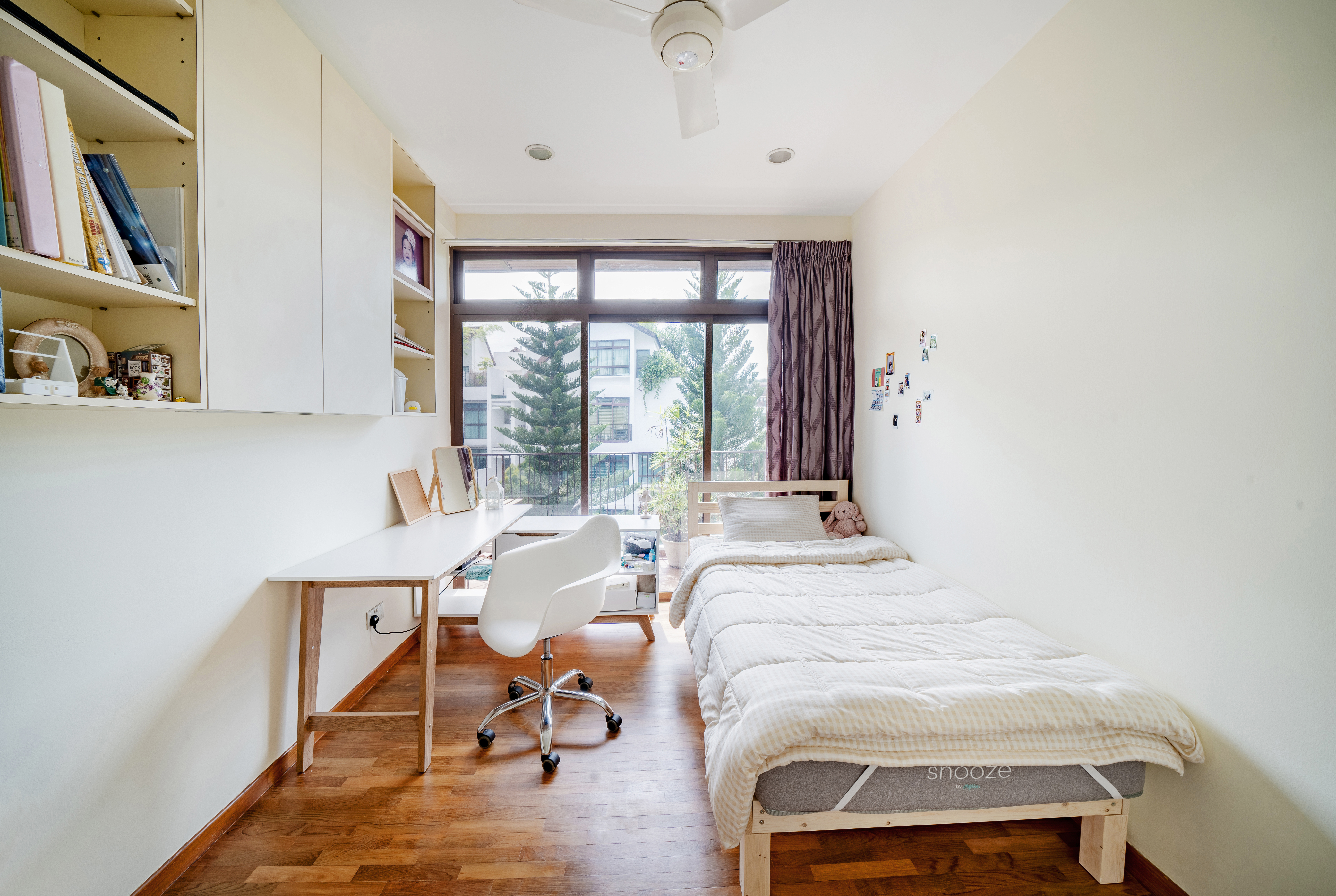 Kids room: Minimal but functional with great sunlight - Wooden floor, white ceiling fan, large window, brown curtains, white