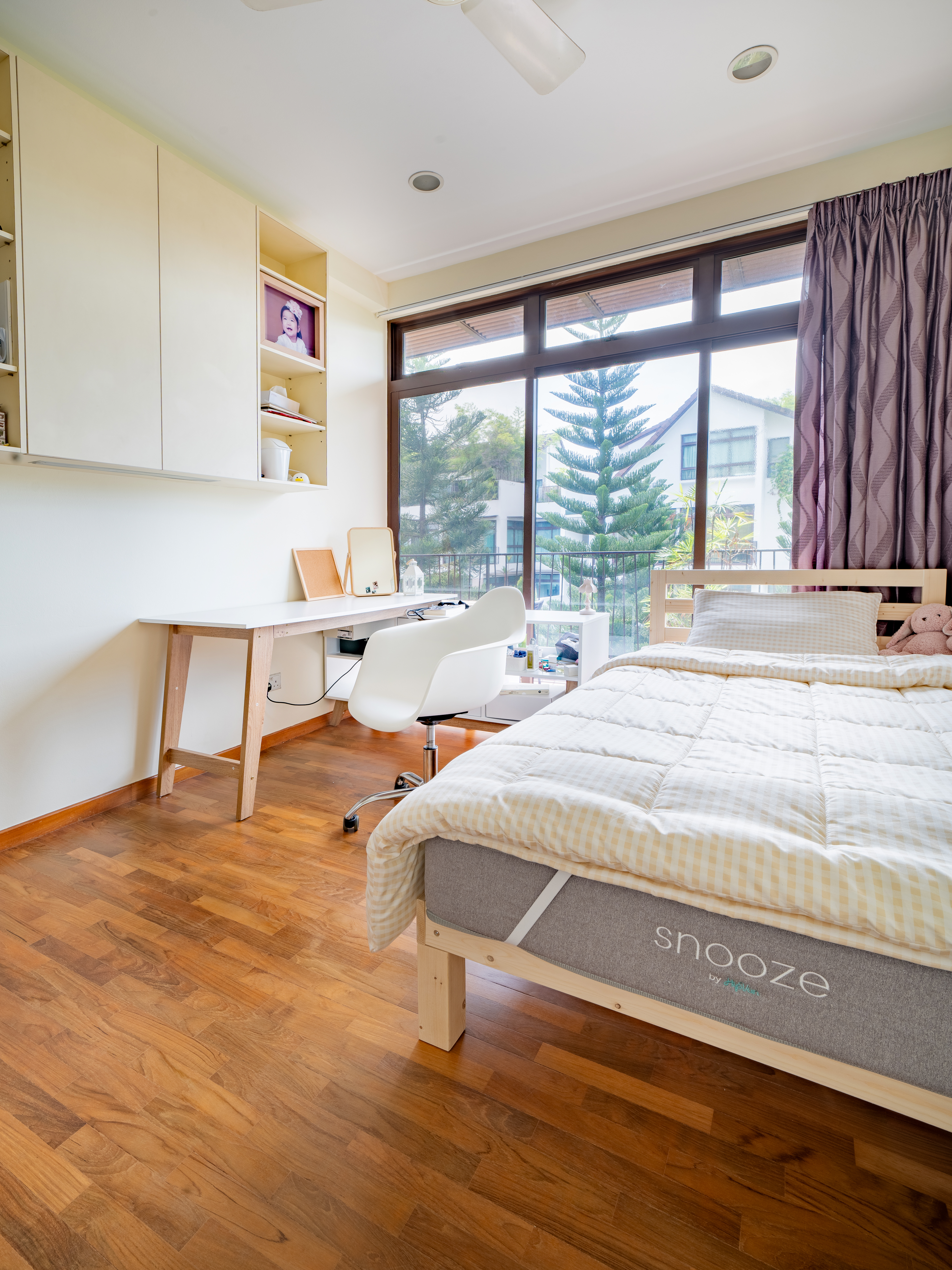 Kids room: Minimal but functional with great sunlight - Wooden floor, wooden cabinets, white desk, white chair, large window