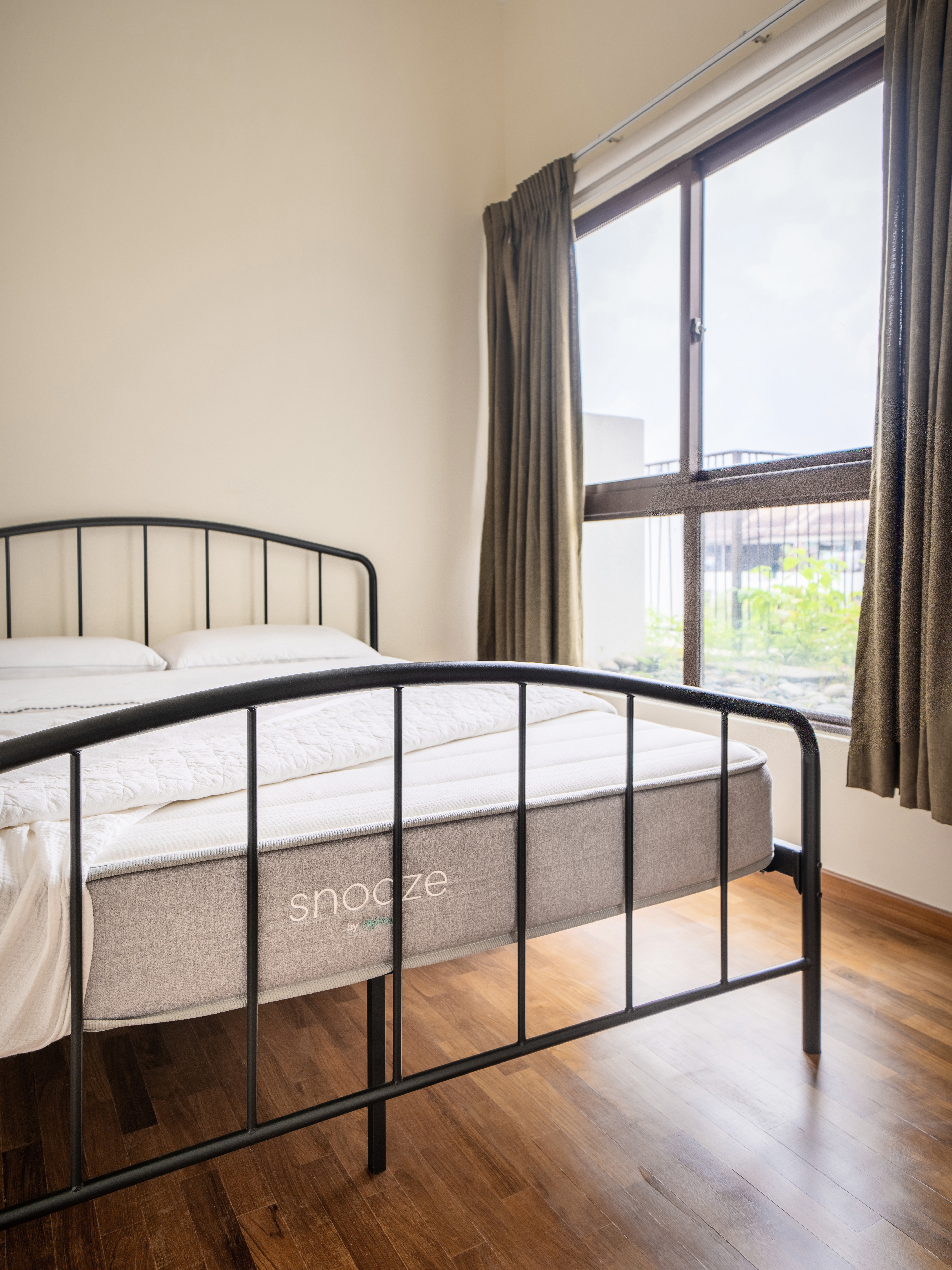 We kept our bedroom serene and minimal! - Modern minimalist bedroom, cozy bed with gray mattress, black metal frame, wooden