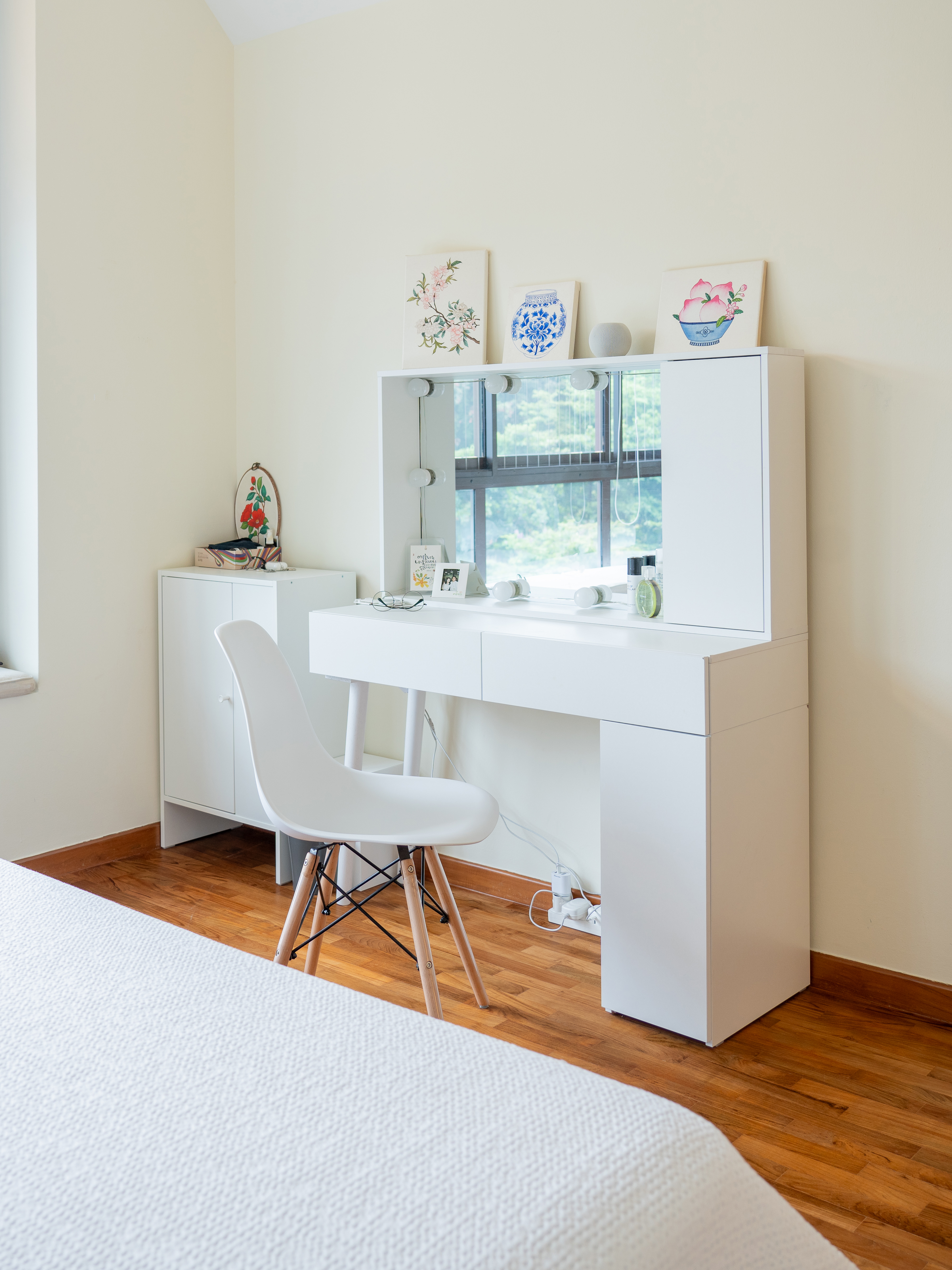 Keeping it simple in our our cosy master bedroom - White vanity with mirror, framed floral artwork, blue and white ceramic