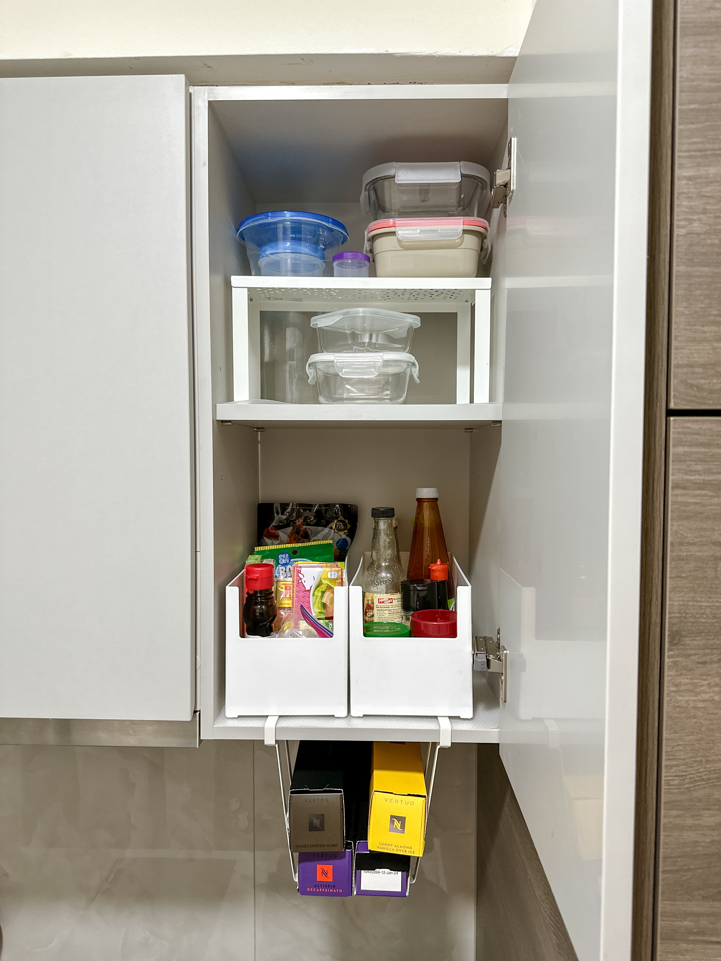A little tour of our kitchen organizers! ✨ - Clear plastic containers, white shelving unit, organized storage, transparent