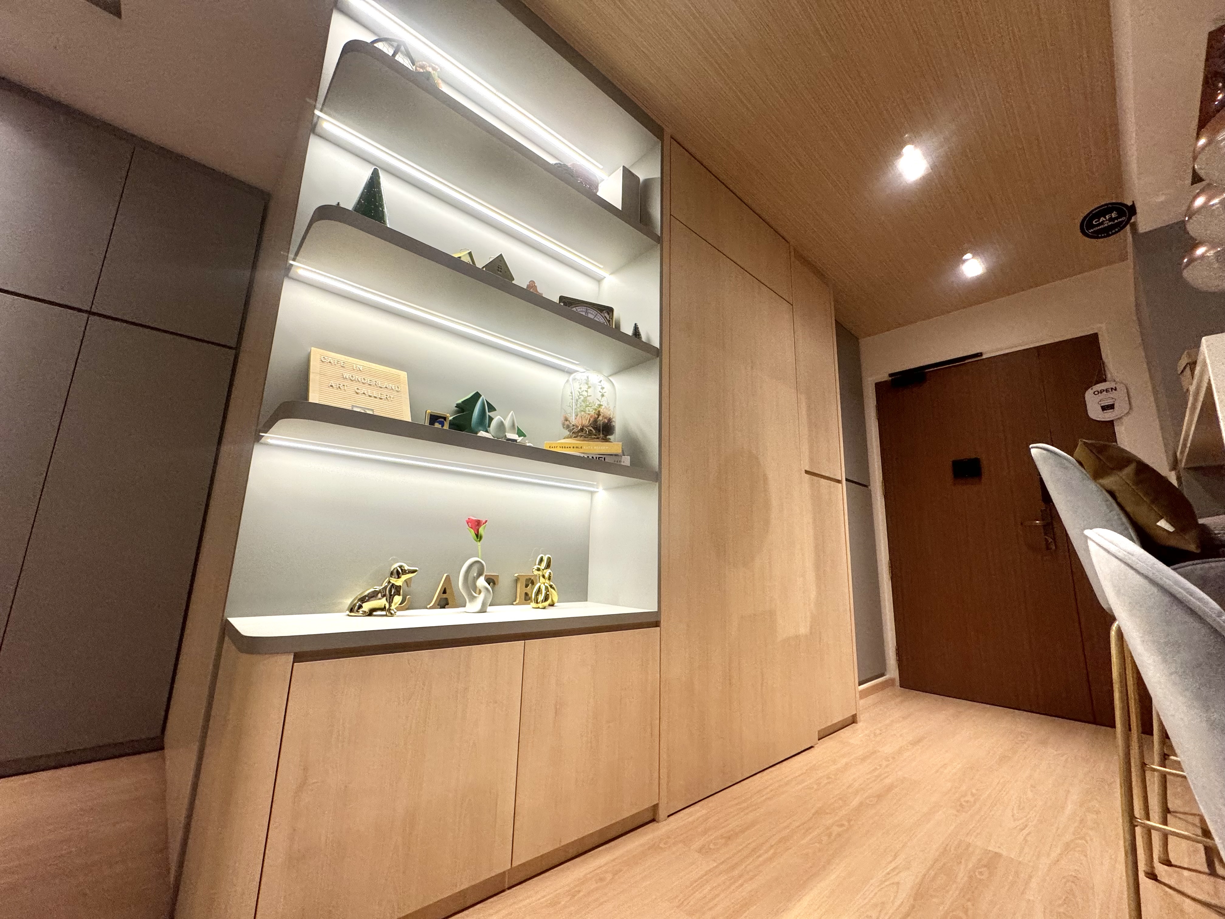 3 Non-Essentials Reno Costs We Saved On - Shelf with decorative items, minimalist interior design, modern decor, wooden