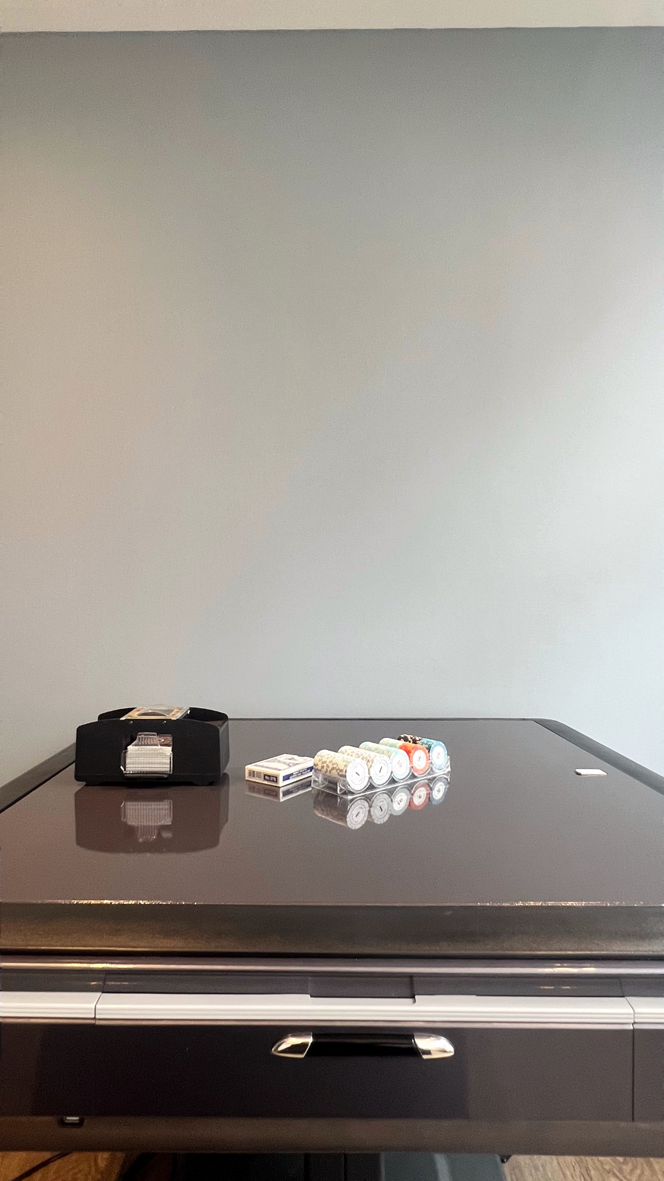 Mahjong, Movies, and My Frenemy: Tales from Entertainment Room - Black desk, cigarette pack, cigarette pack holder, stack of