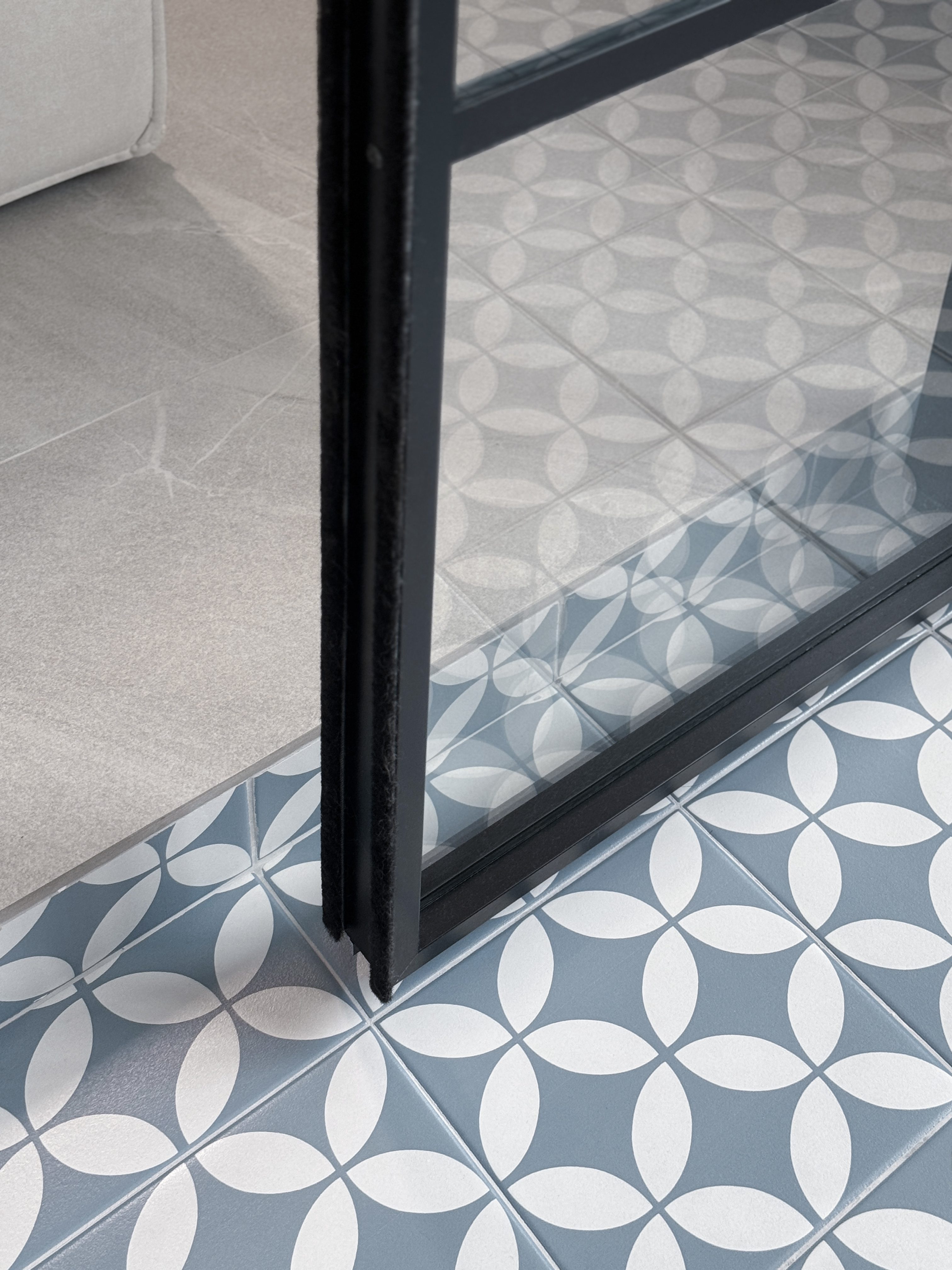 Café Vibes at Home in this Stunning High-Ceiling Balcony - Modern floor tiles with geometric patterns, light gray and white