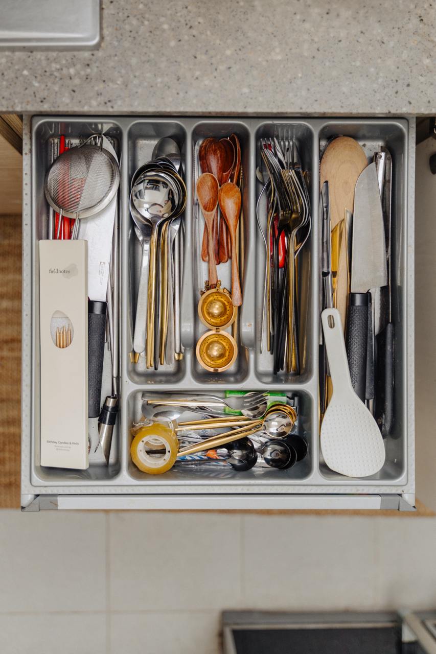 Tiny Kitchen Living: Organisation Tips To Live Mess Free - Kitchen utensils organized neatly, stainless steel drawer, various