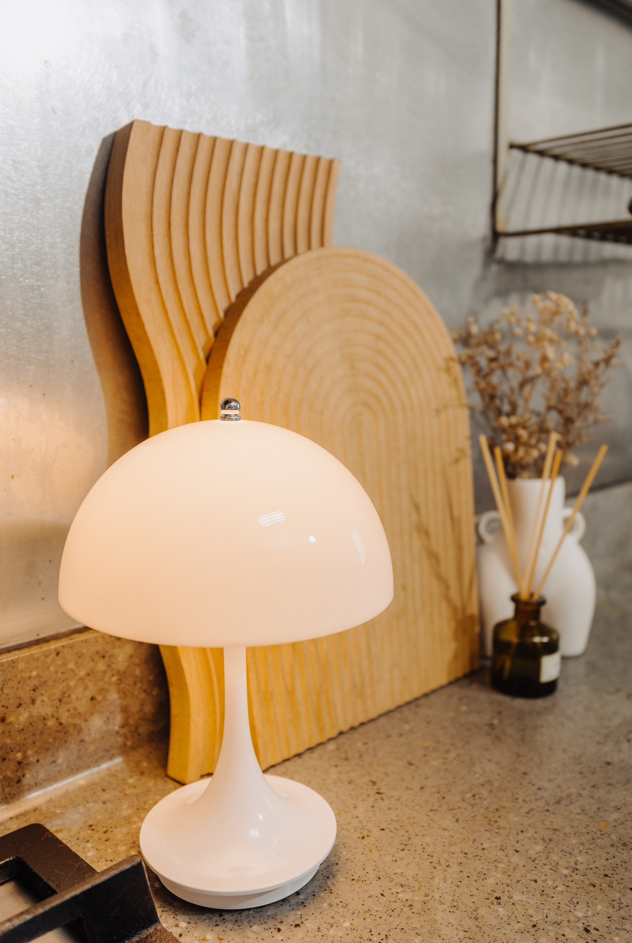 Tiny Kitchen Living: Organisation Tips To Live Mess Free - Wooden kitchen countertop, modern lamp, white lampshade, rustic