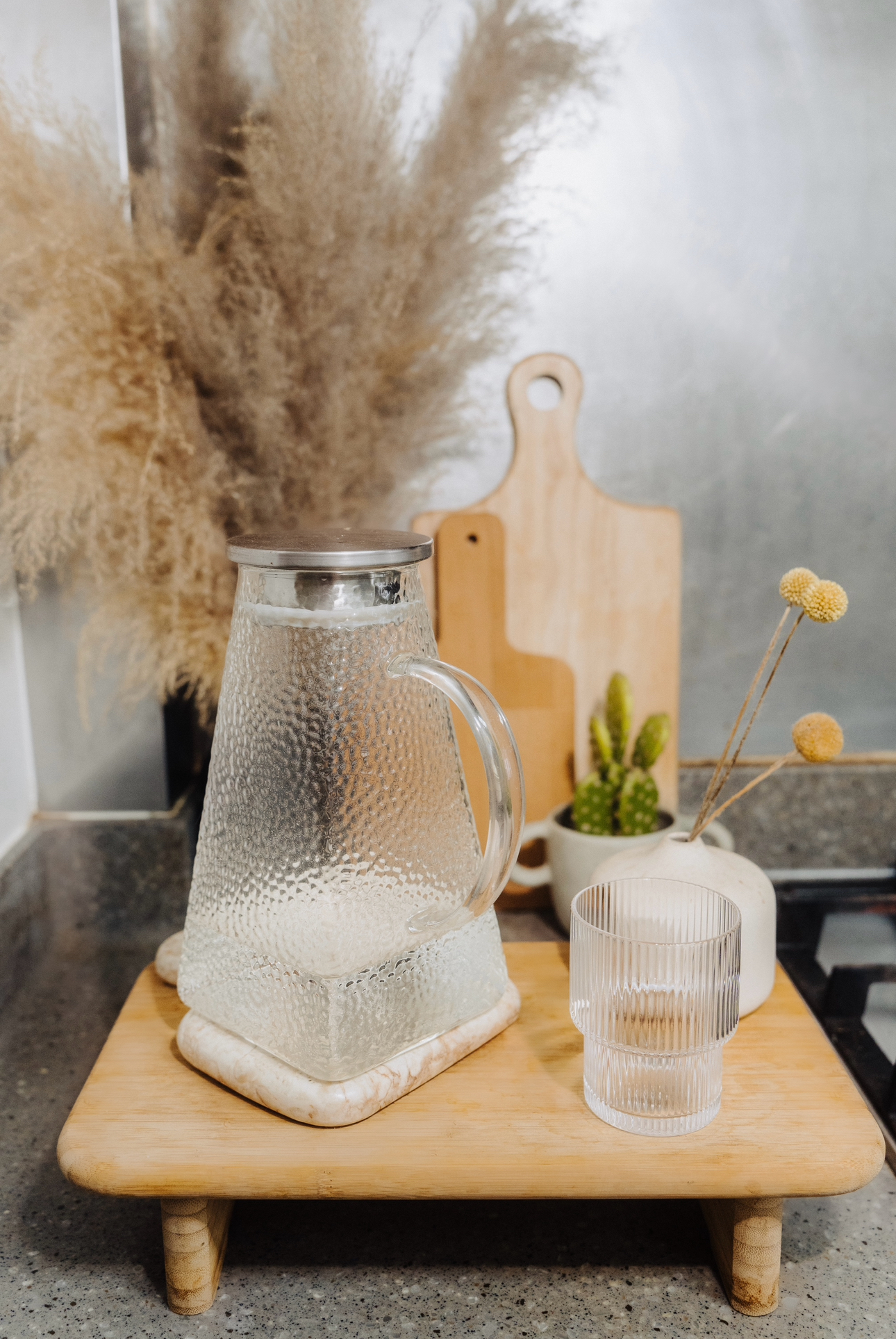 Tiny Kitchen Living: Organisation Tips To Live Mess Free - glass pitcher, clear glass, rustic kitchen, wooden cutting board